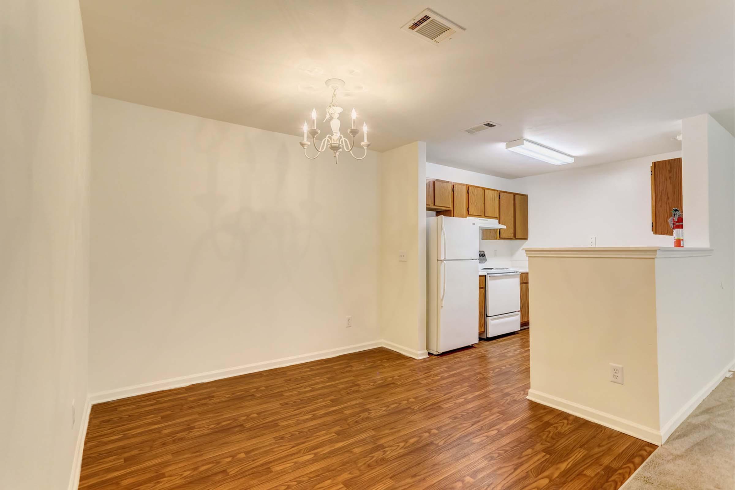 a kitchen with a wood floor