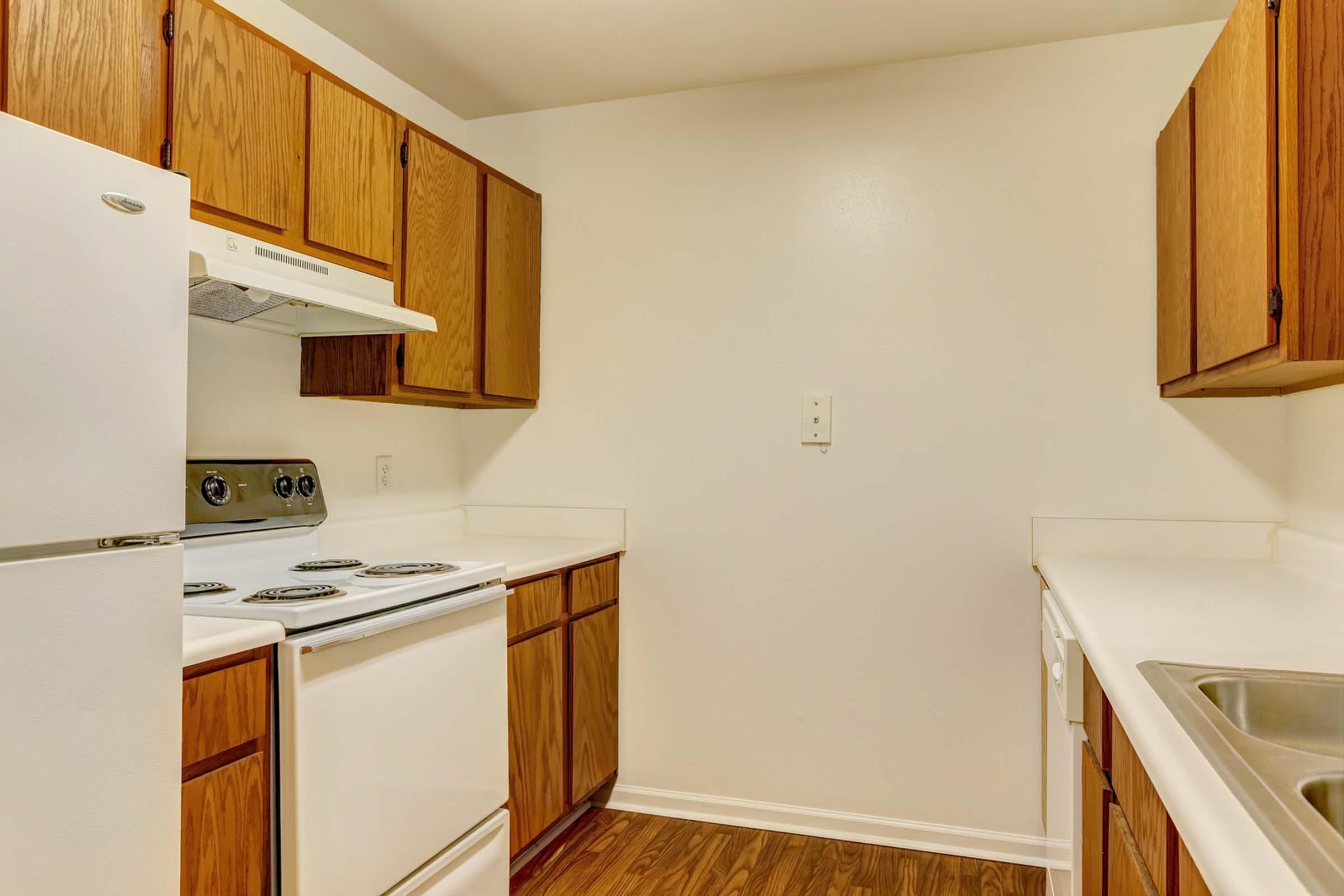 a kitchen with a stove and a refrigerator