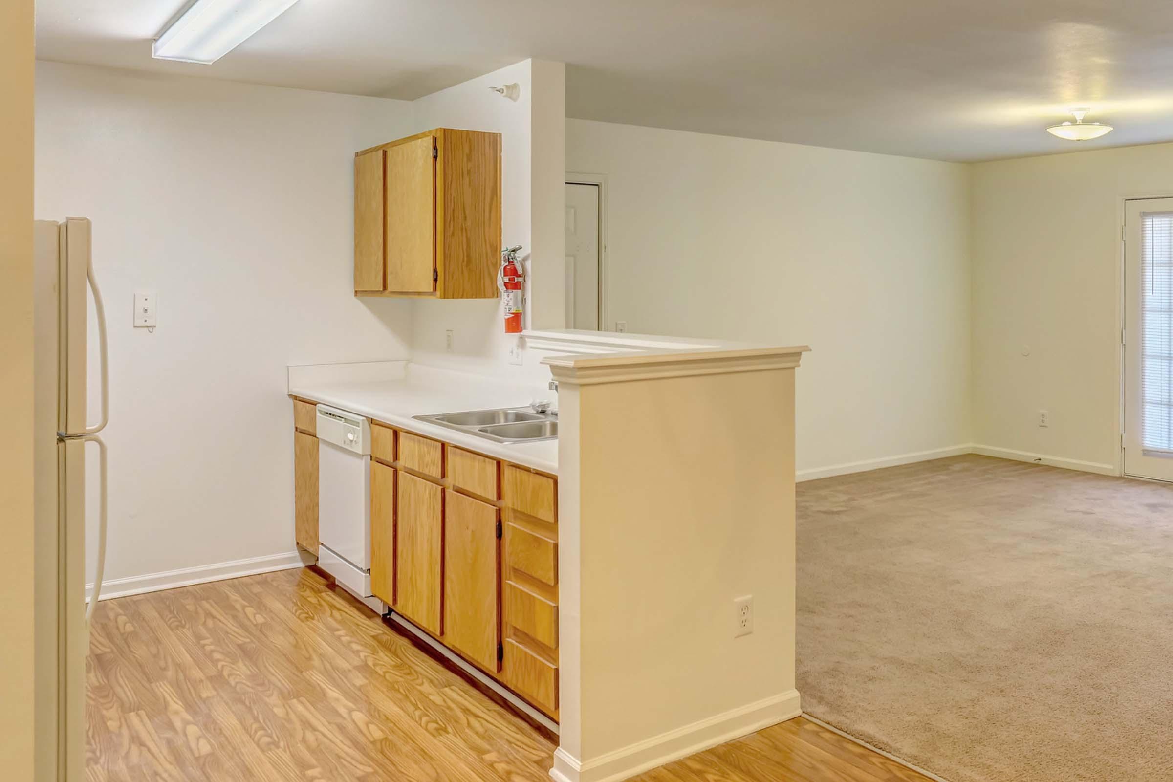 a kitchen with a wood floor