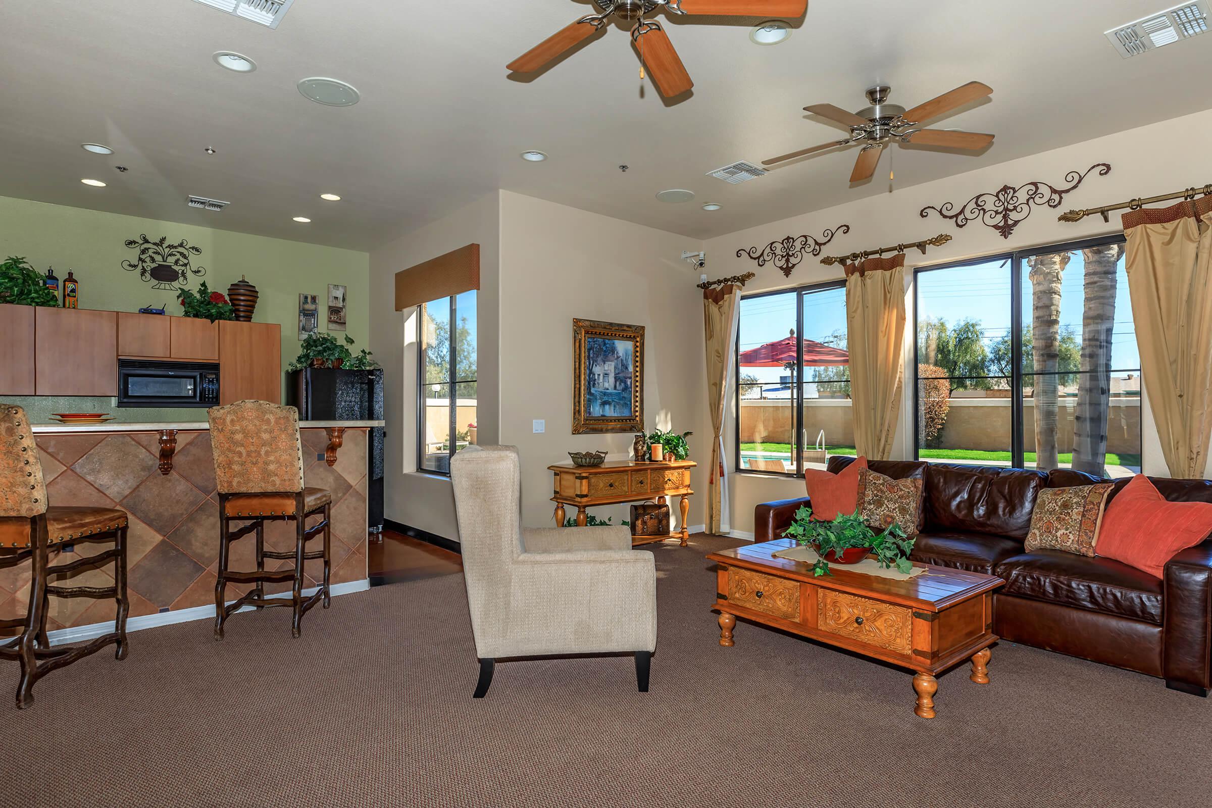 a living room filled with furniture and a large window