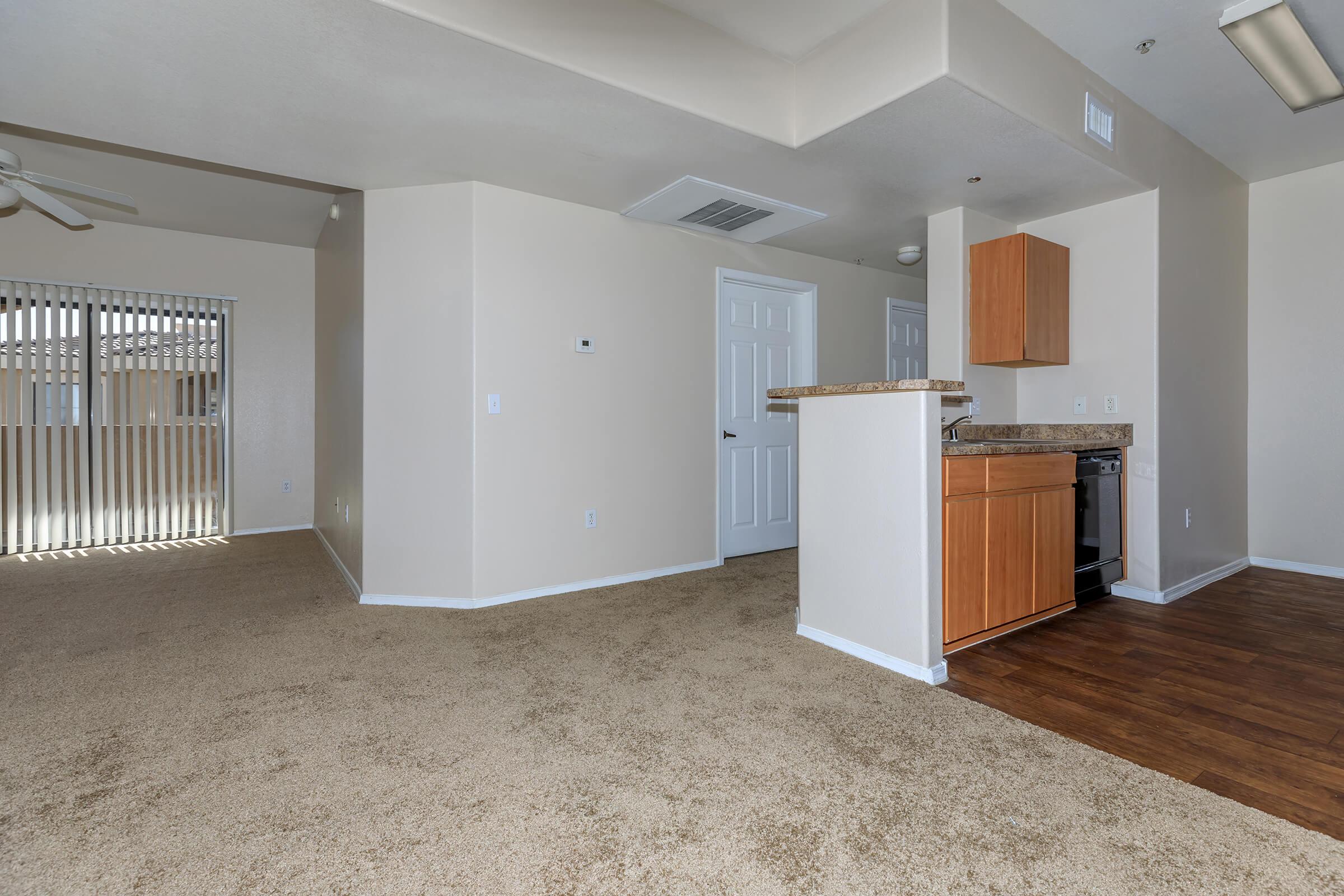 a large empty room with a wooden floor