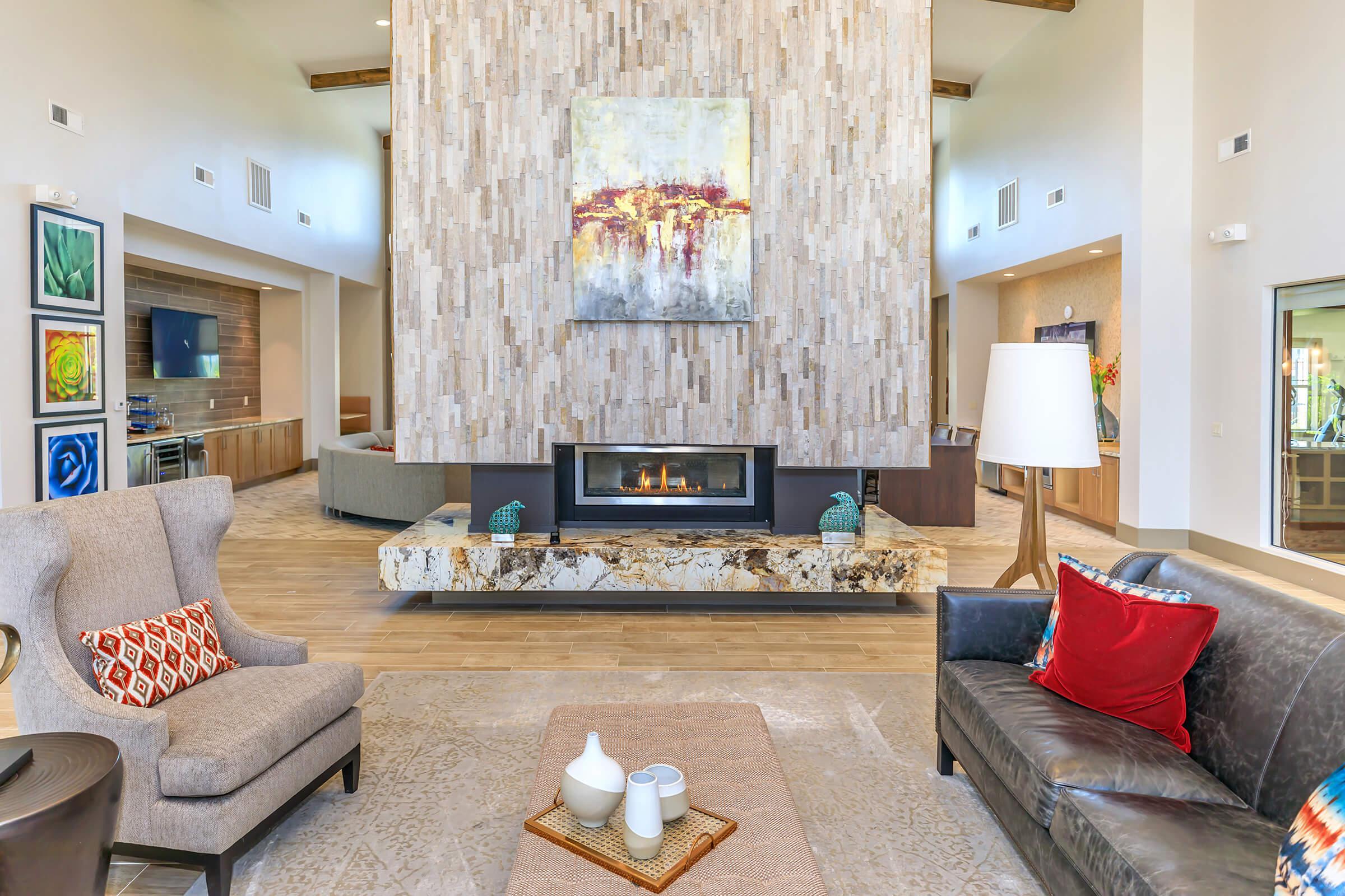 a living room filled with furniture and a fire place