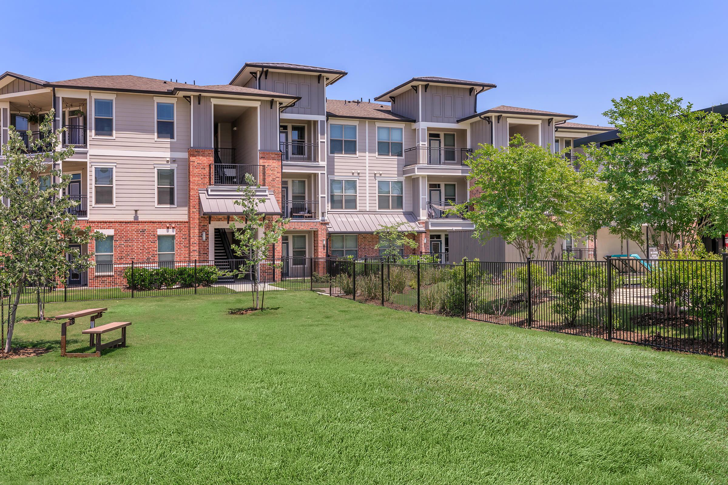 a large lawn in front of a building