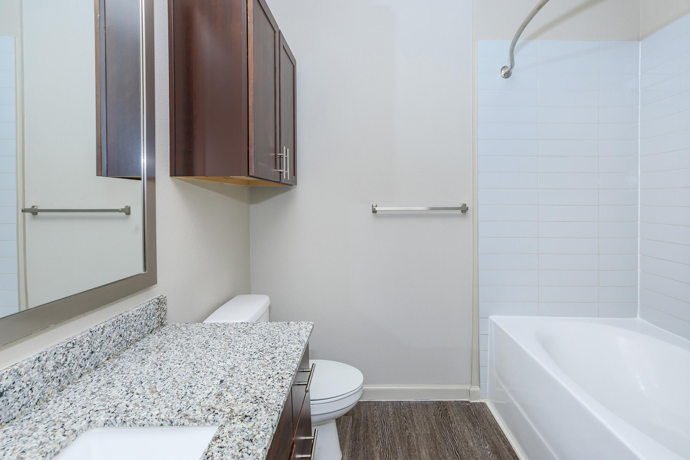 a bedroom with a shower and a sink