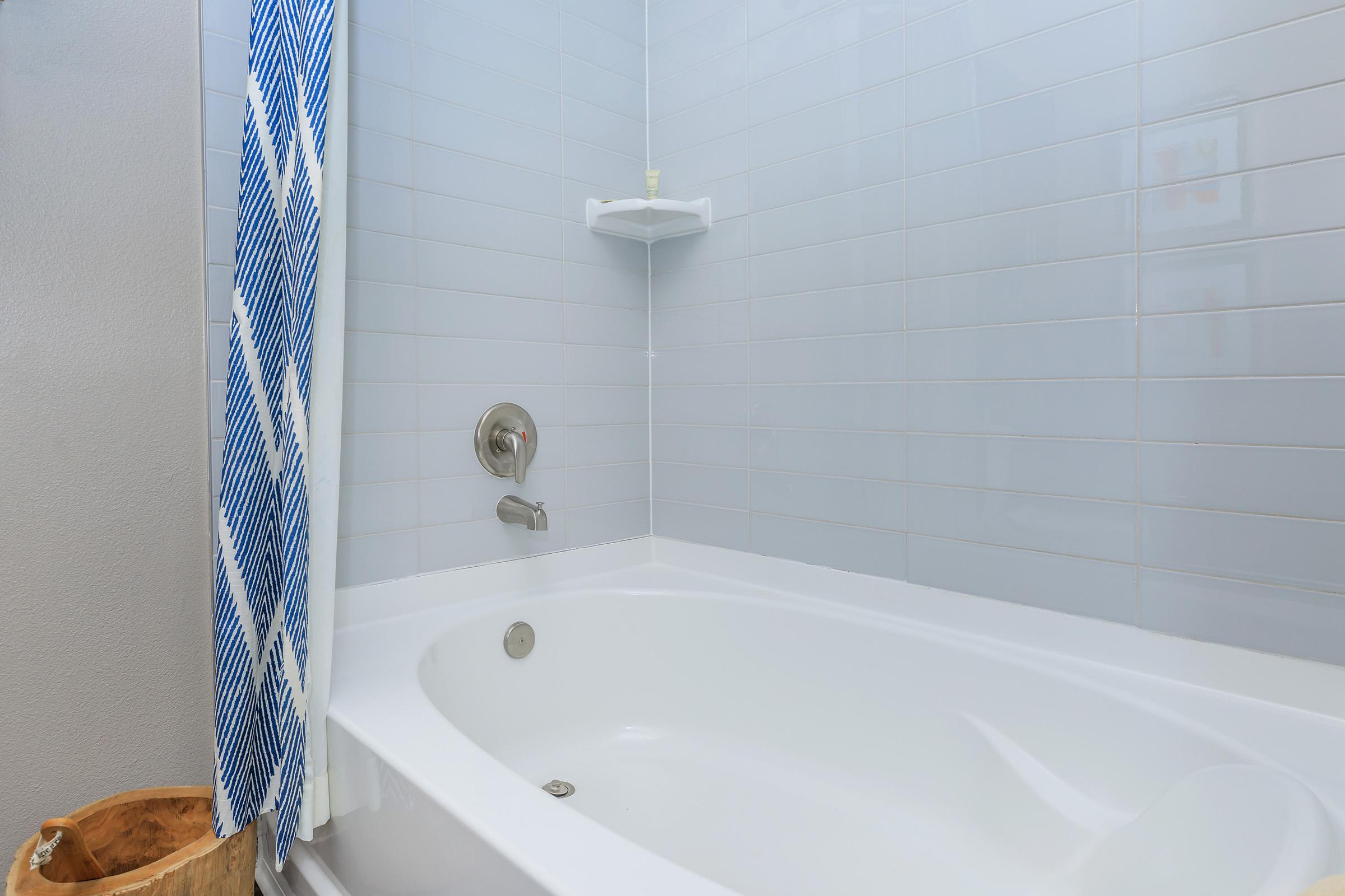 a close up of a sink and a bath tub