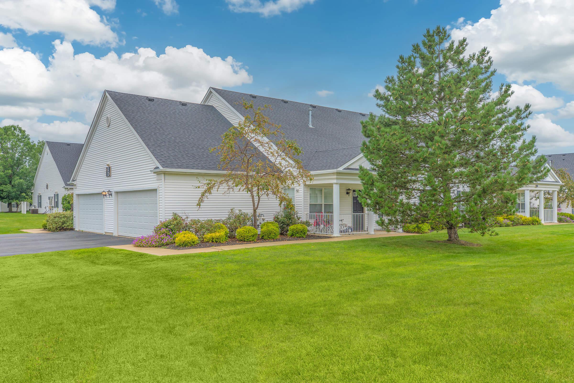 a large lawn in front of a house