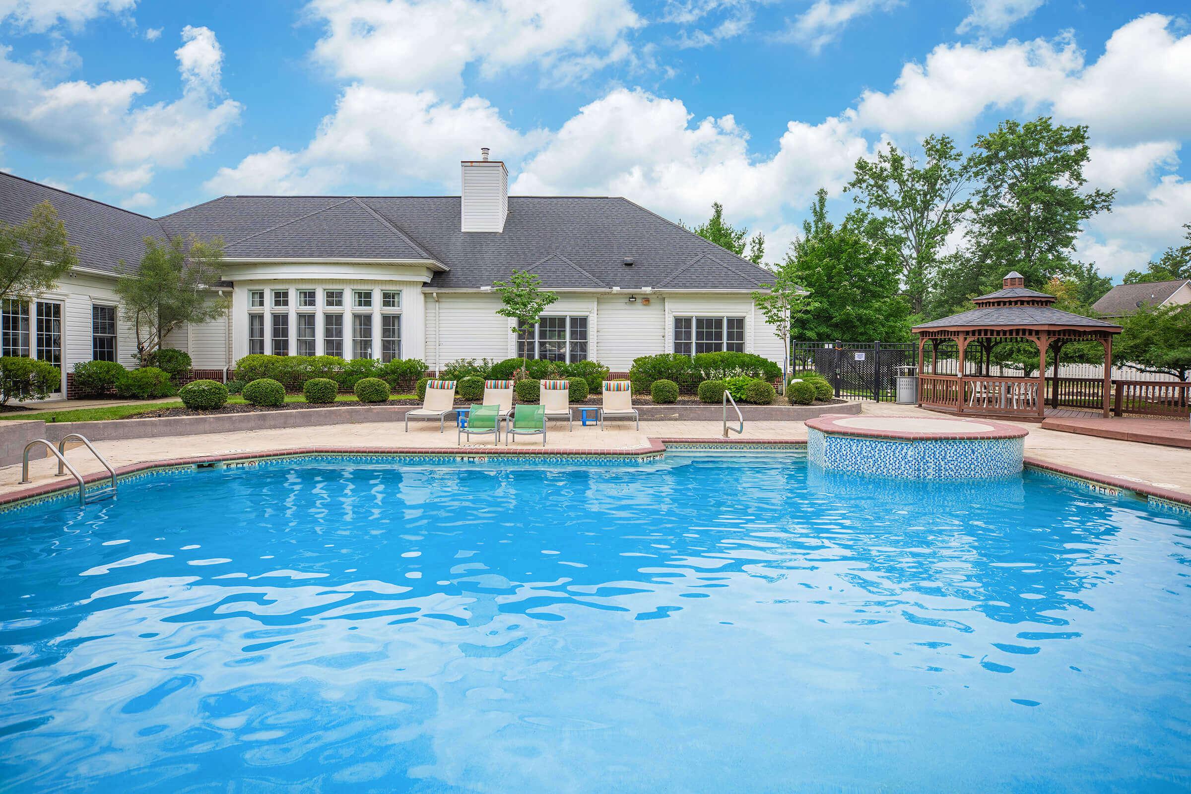 a large pool of water in front of a house