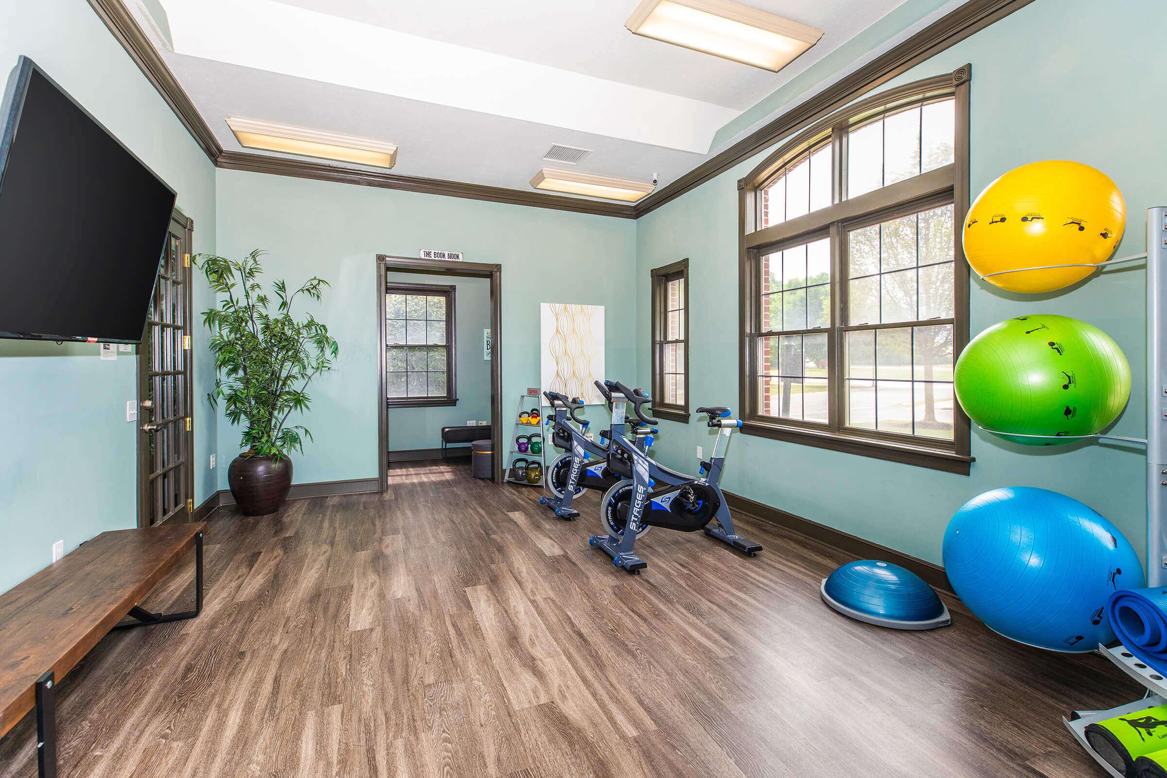 a room filled with furniture and a large window