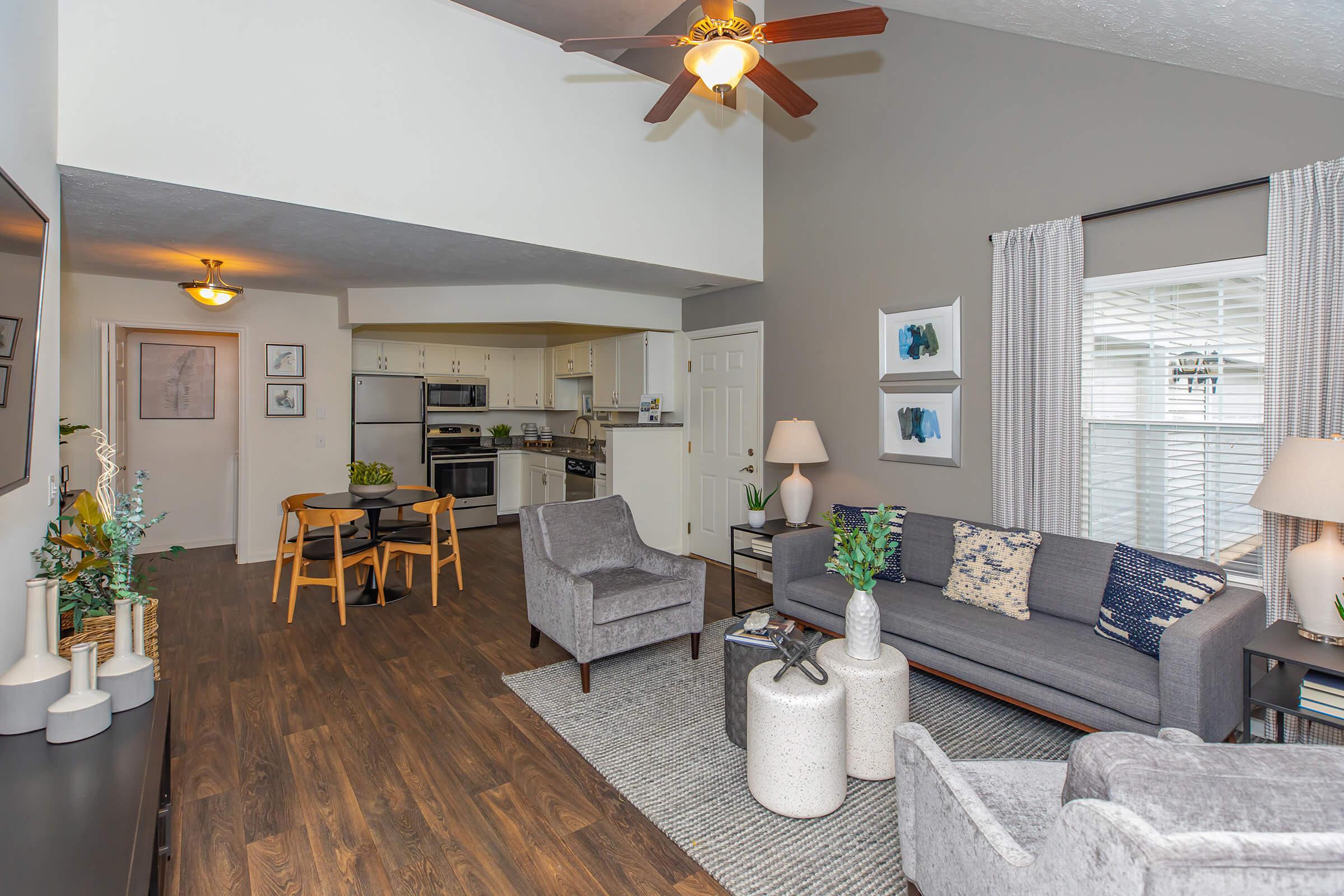 a living room filled with furniture and a table