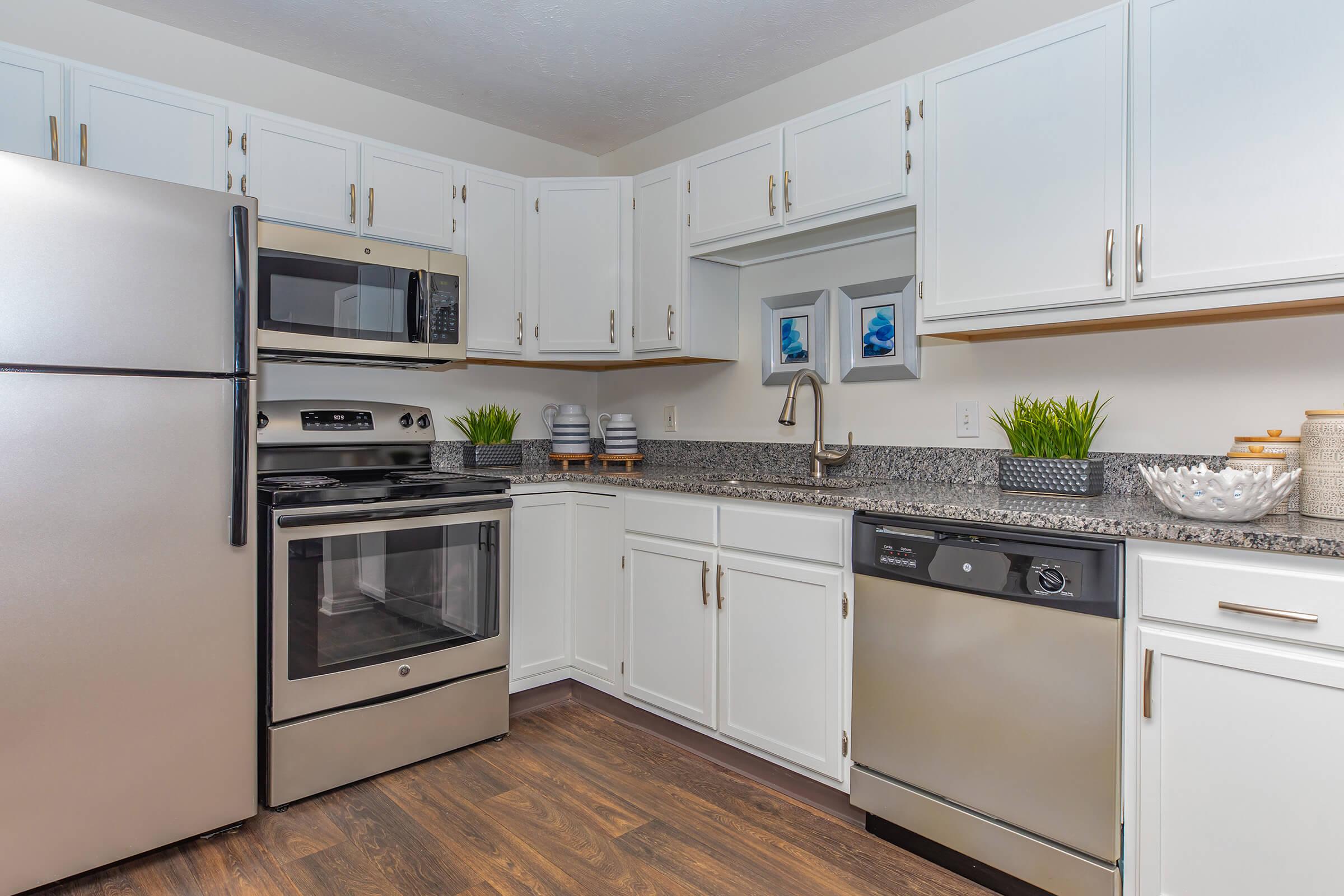 a kitchen with a stove top oven sitting inside of a refrigerator