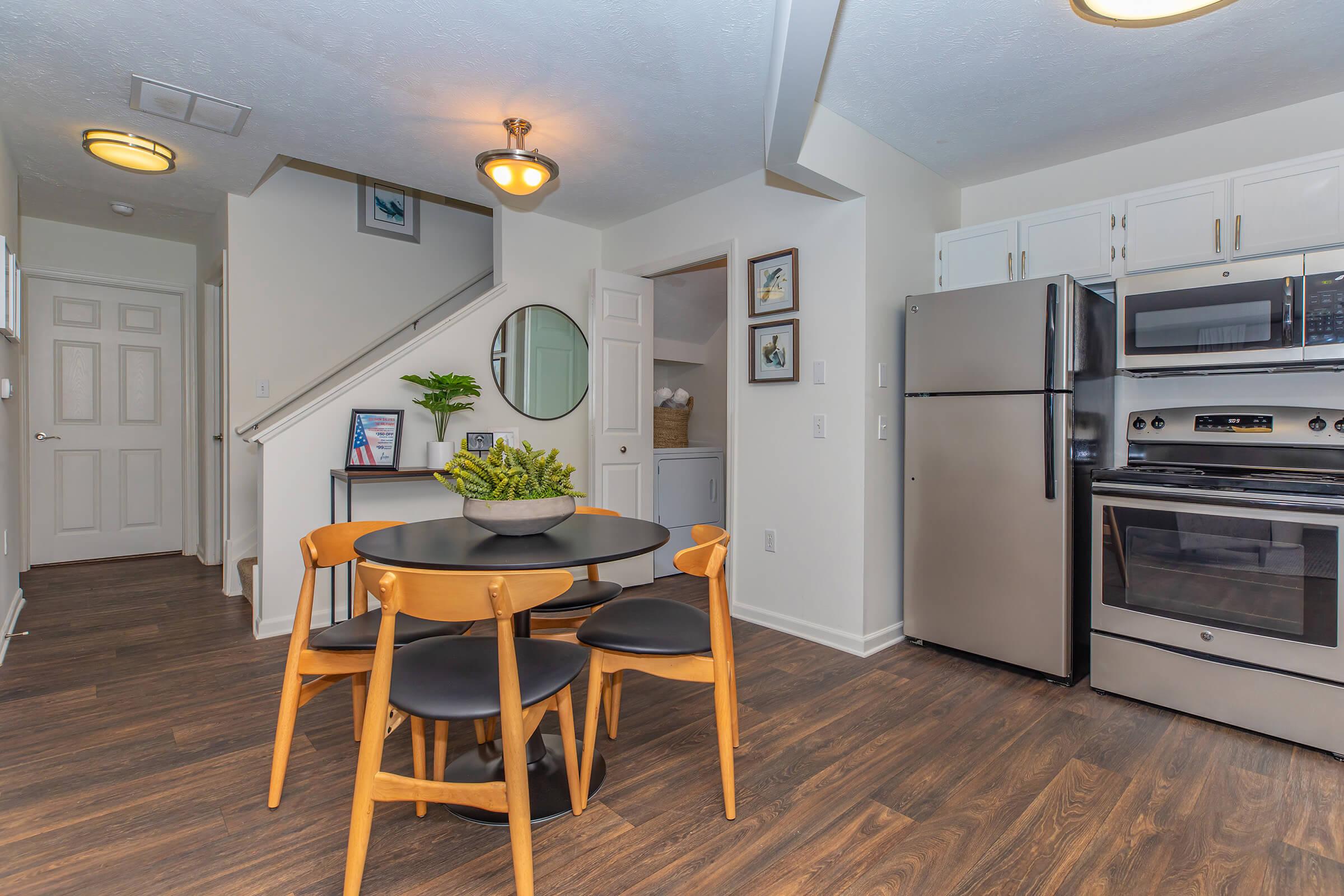 a kitchen with a dining room table