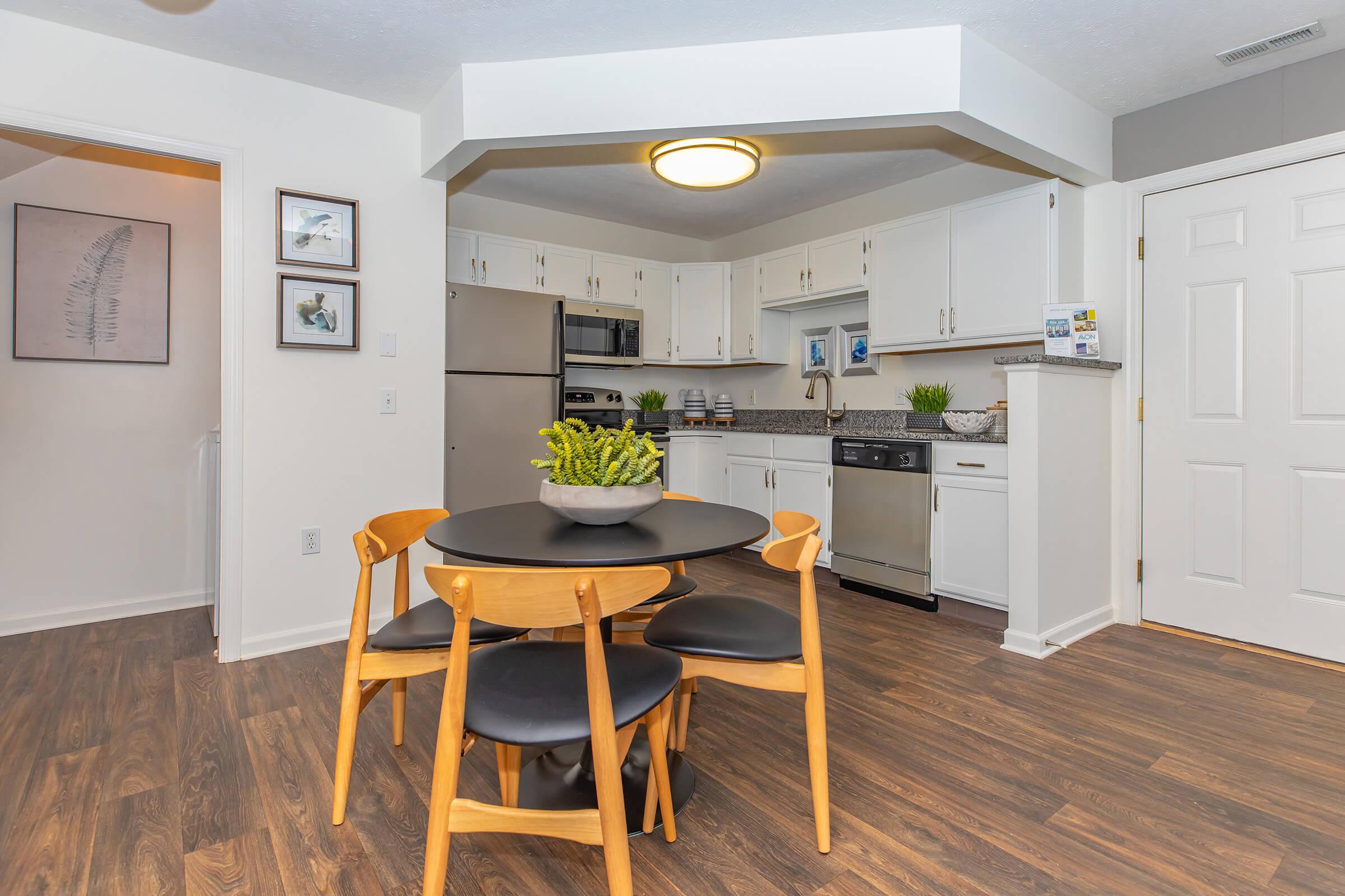 a kitchen with a dining room table