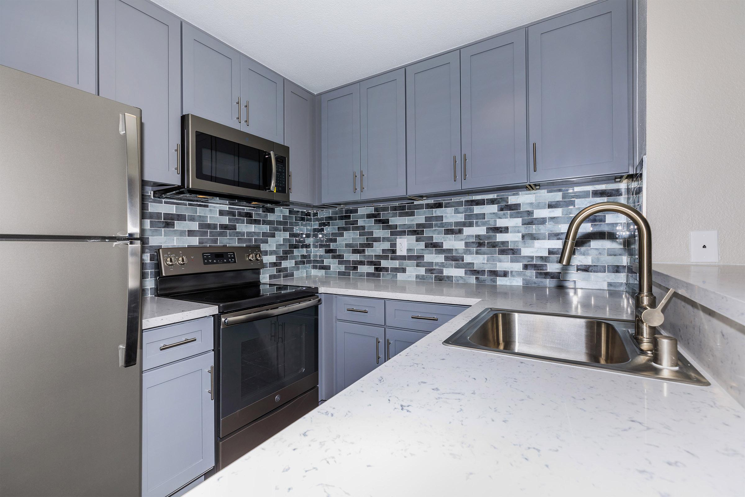 a stainless steel refrigerator in a kitchen