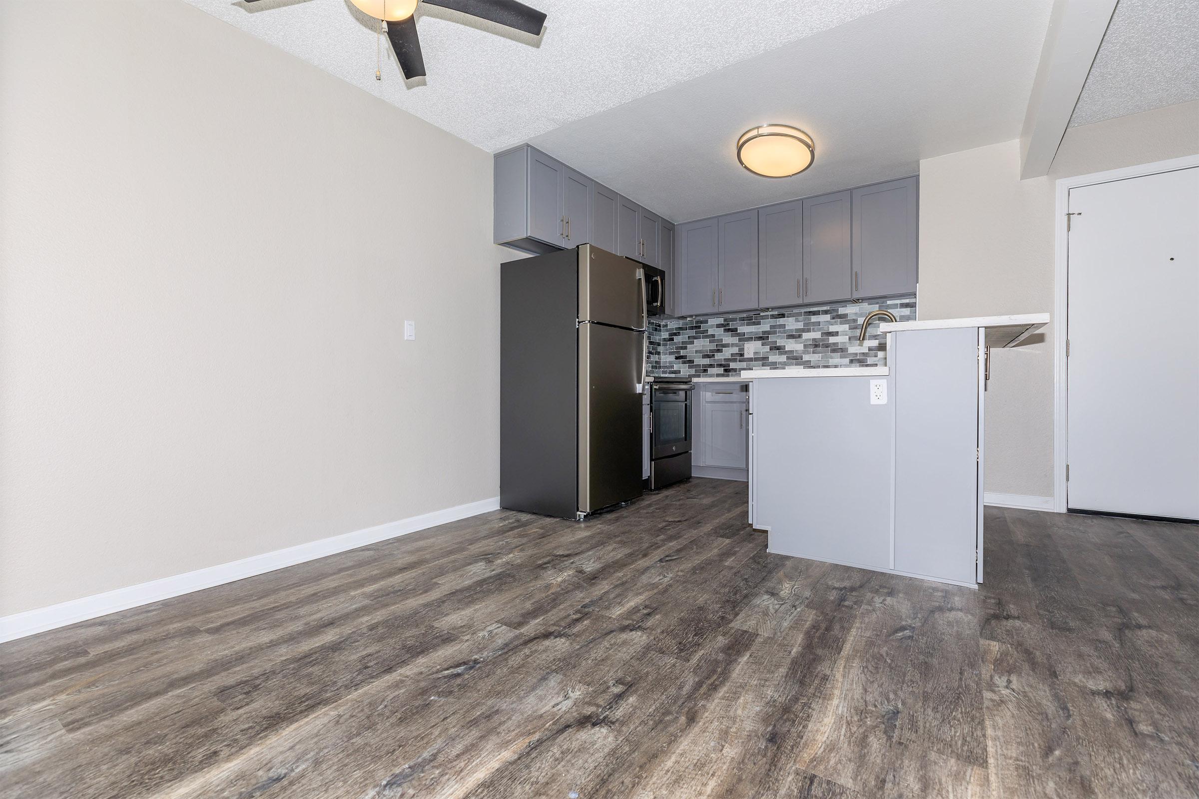 a kitchen with a building in the background