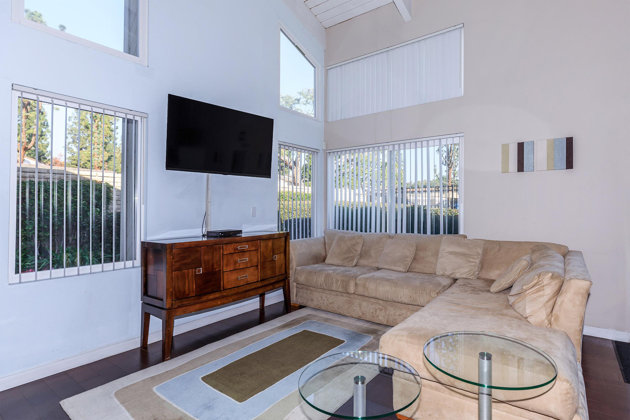 a living room filled with furniture and a fireplace