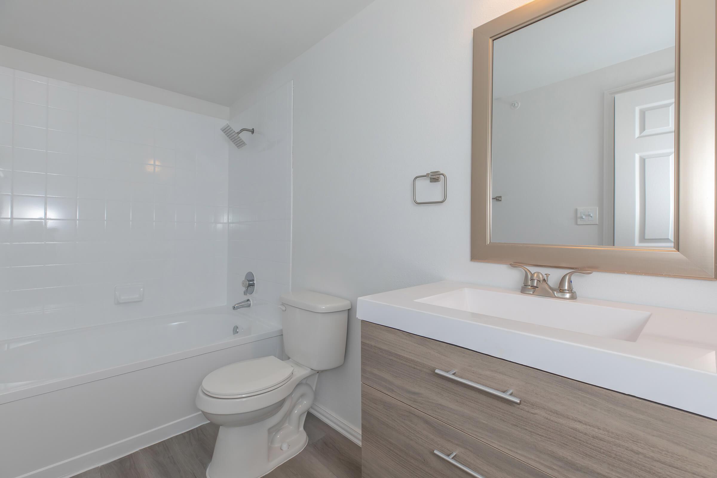 a room with a sink and a mirror