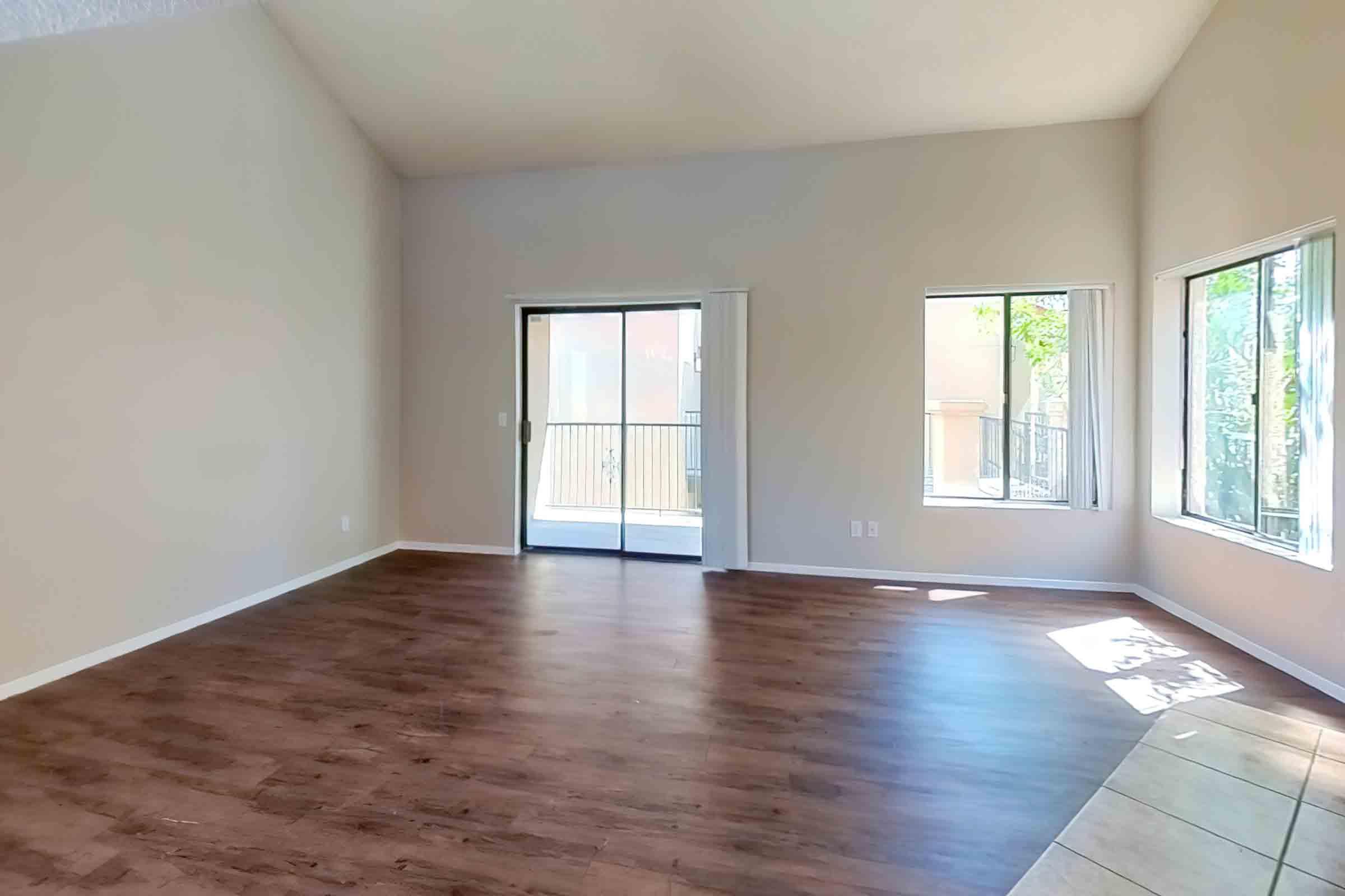 a large empty room with a hard wood floor