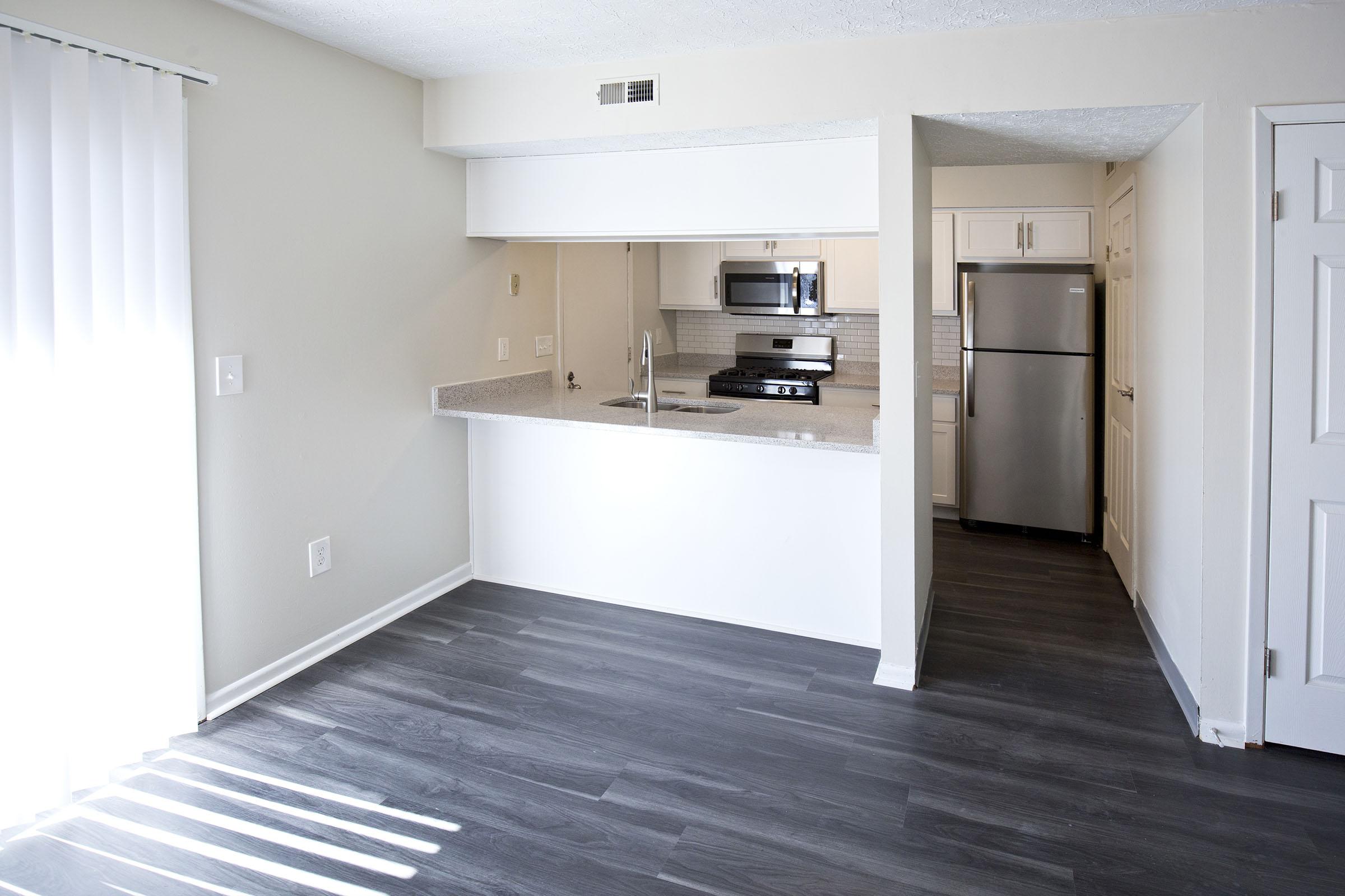 a kitchen with a wooden floor