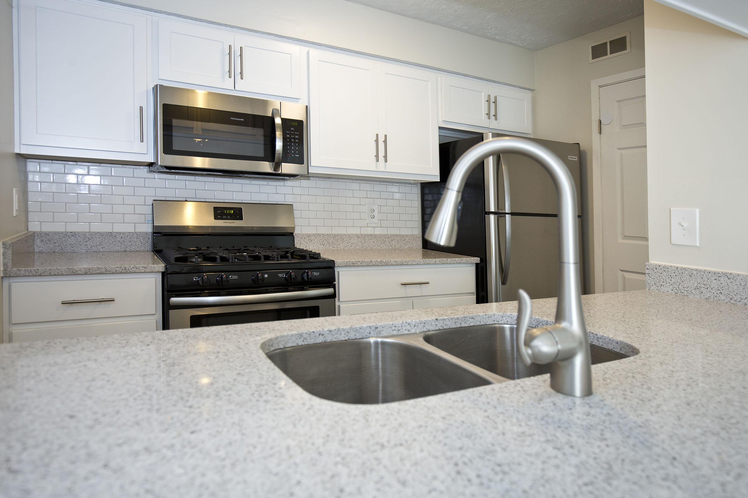 a modern kitchen with stainless steel appliances