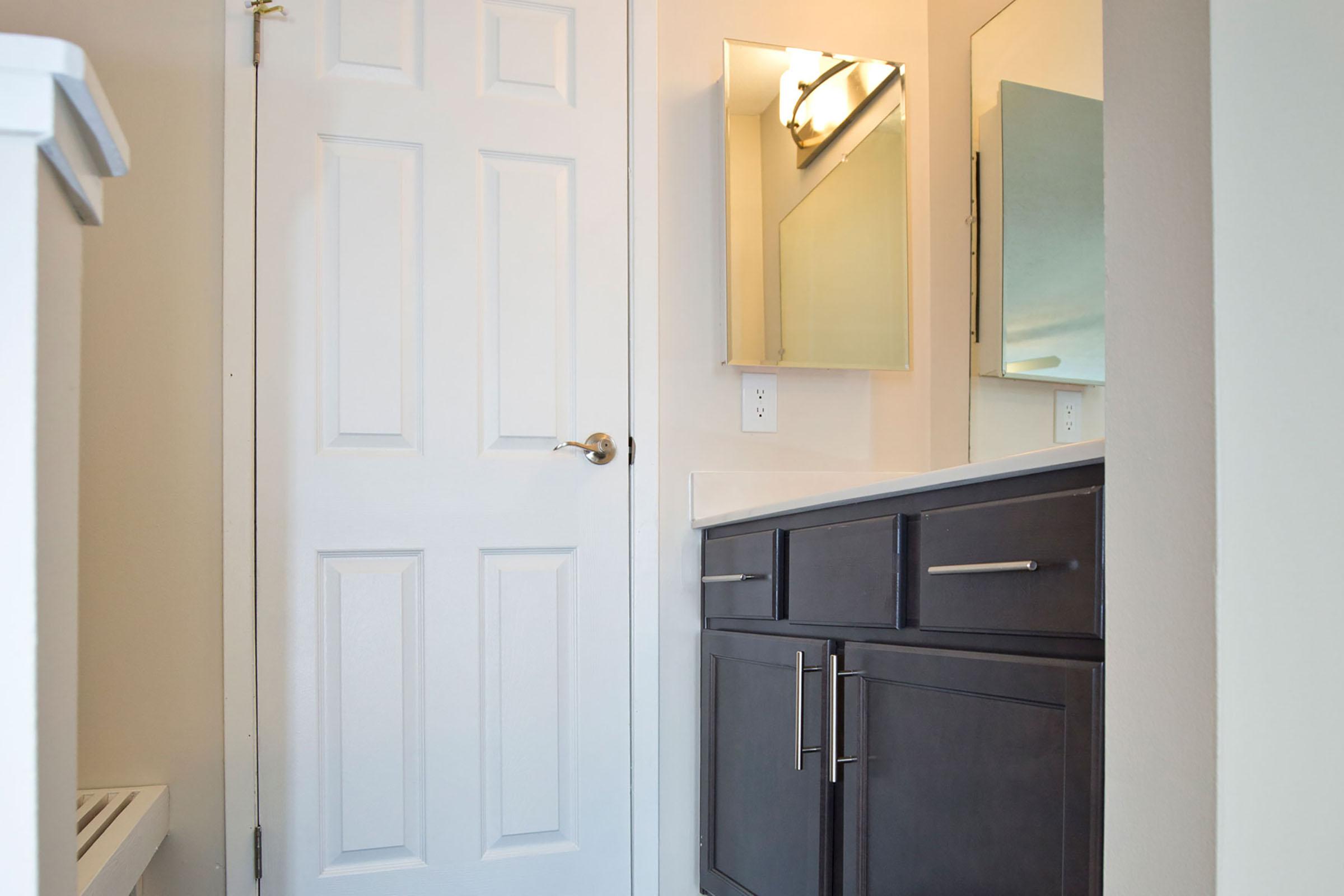 a kitchen with a sink and a refrigerator