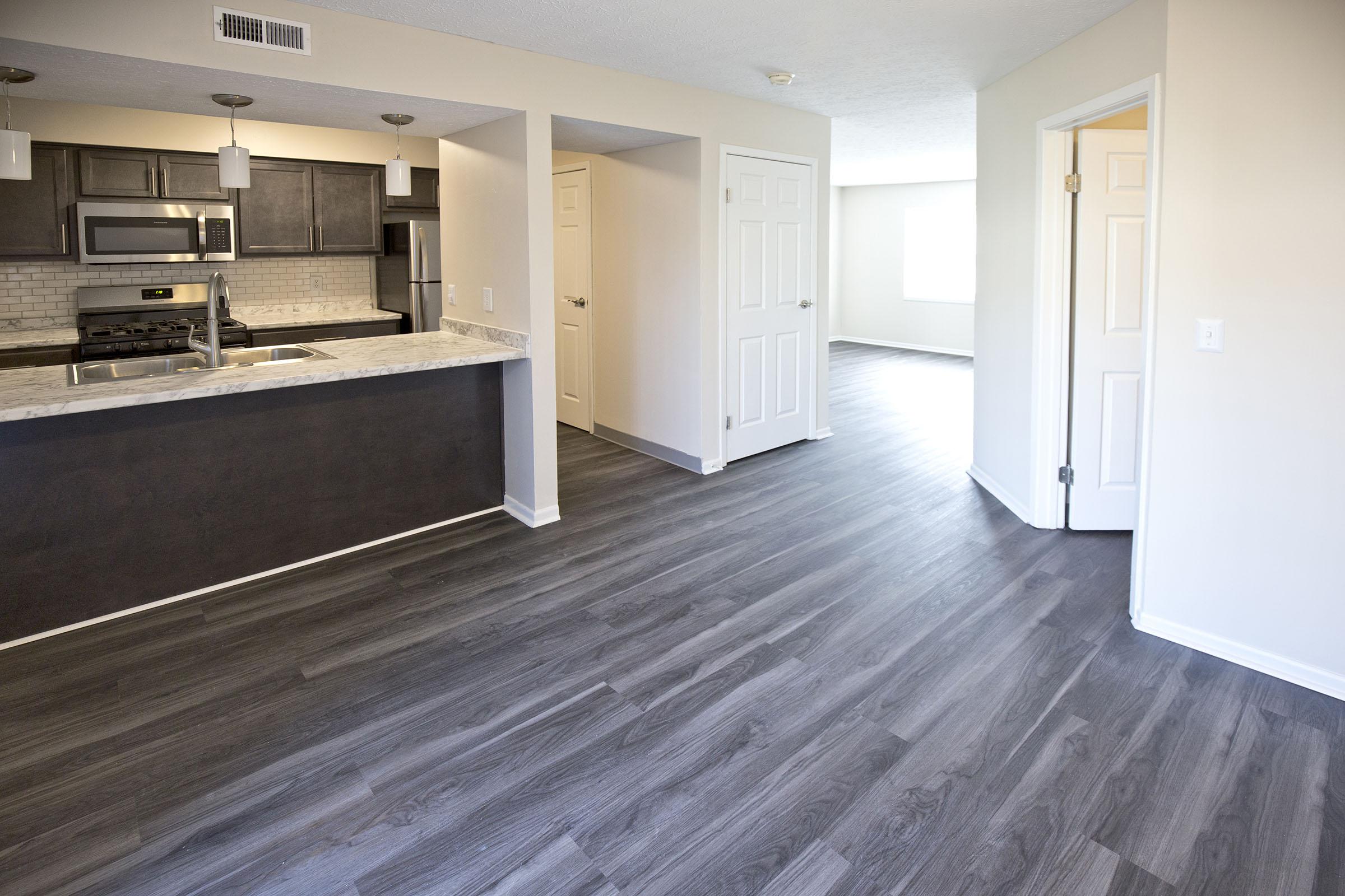 a kitchen with a wooden floor