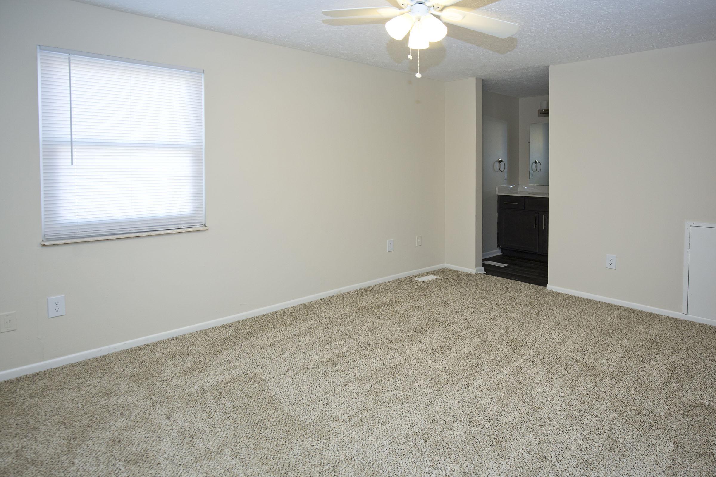 a bedroom with a large mirror