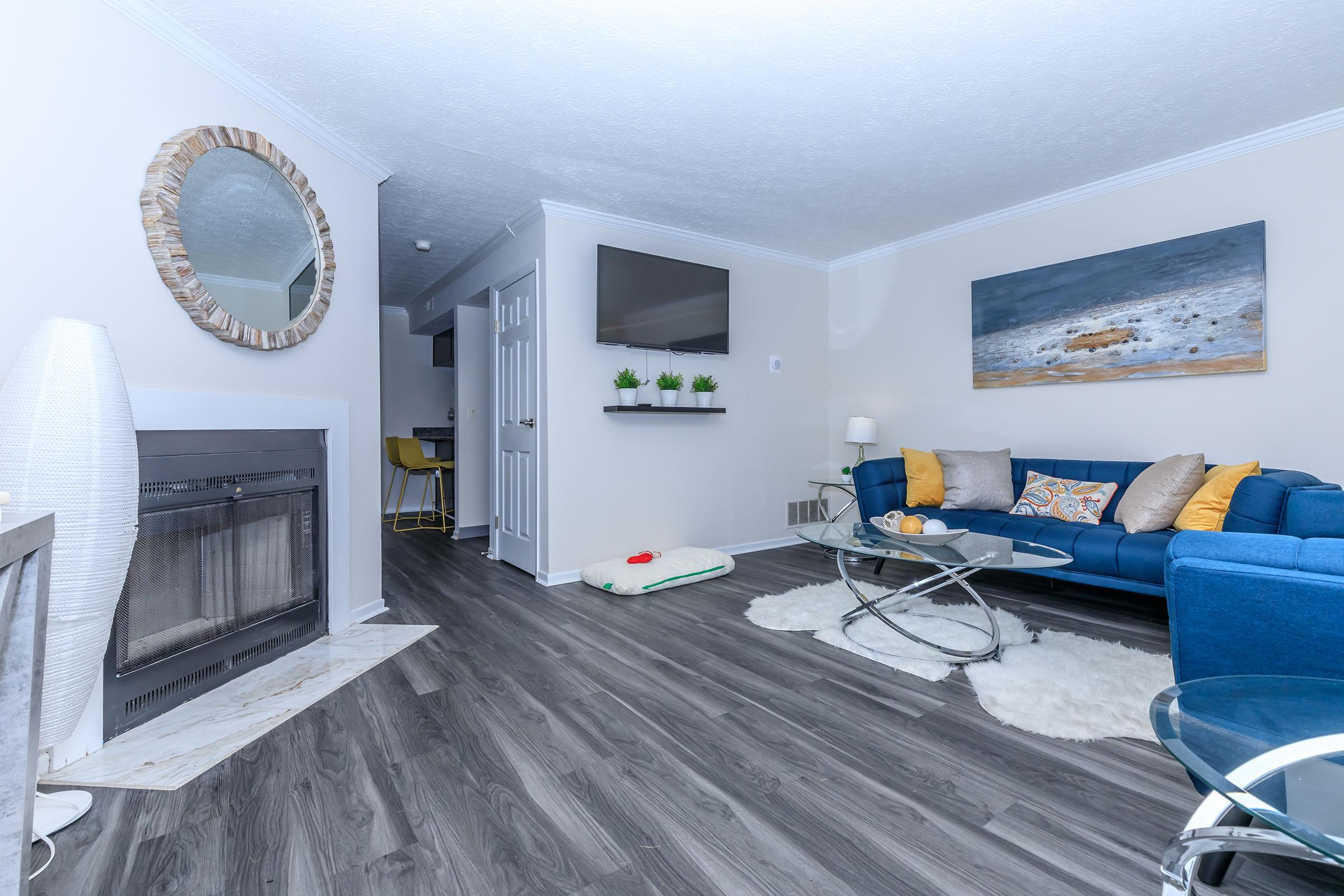 a room filled with furniture and a fireplace