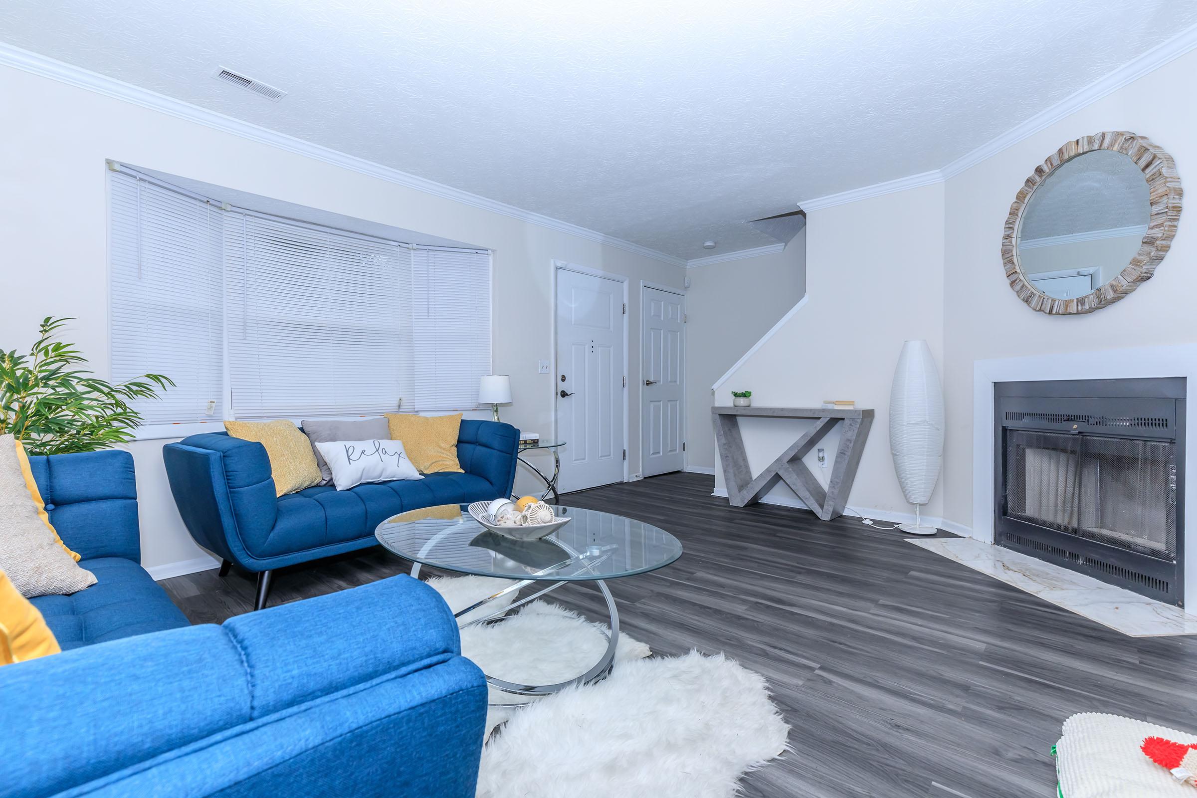 a living room filled with furniture and a flat screen tv