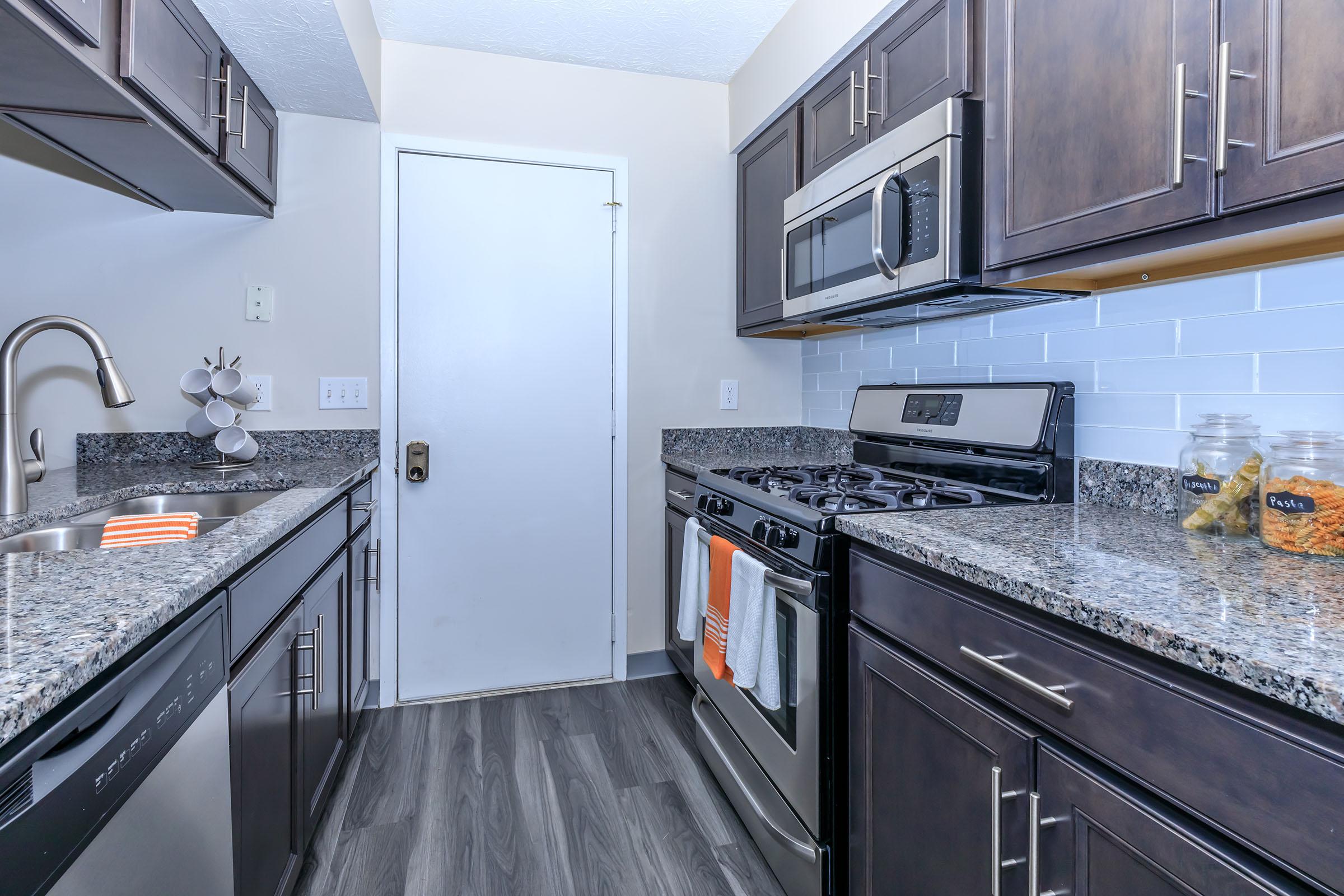 a large kitchen with stainless steel appliances