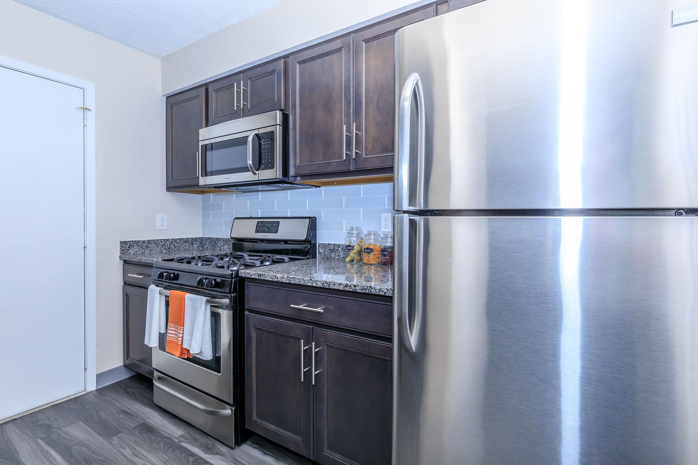 a stainless steel refrigerator in a kitchen