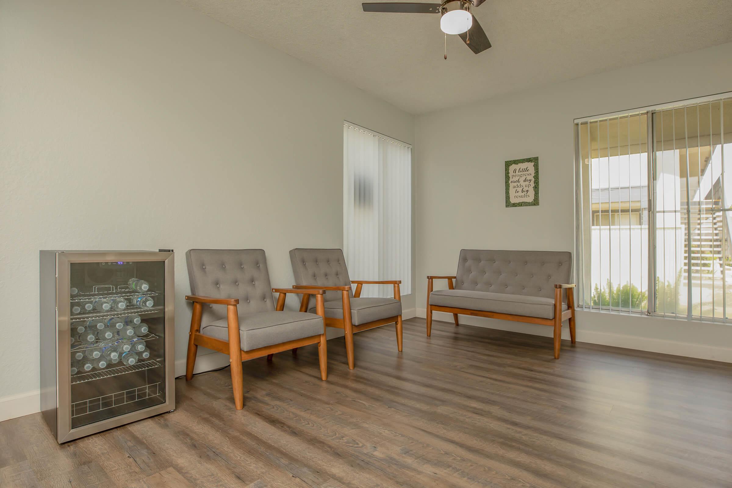 a room filled with furniture and a wood floor