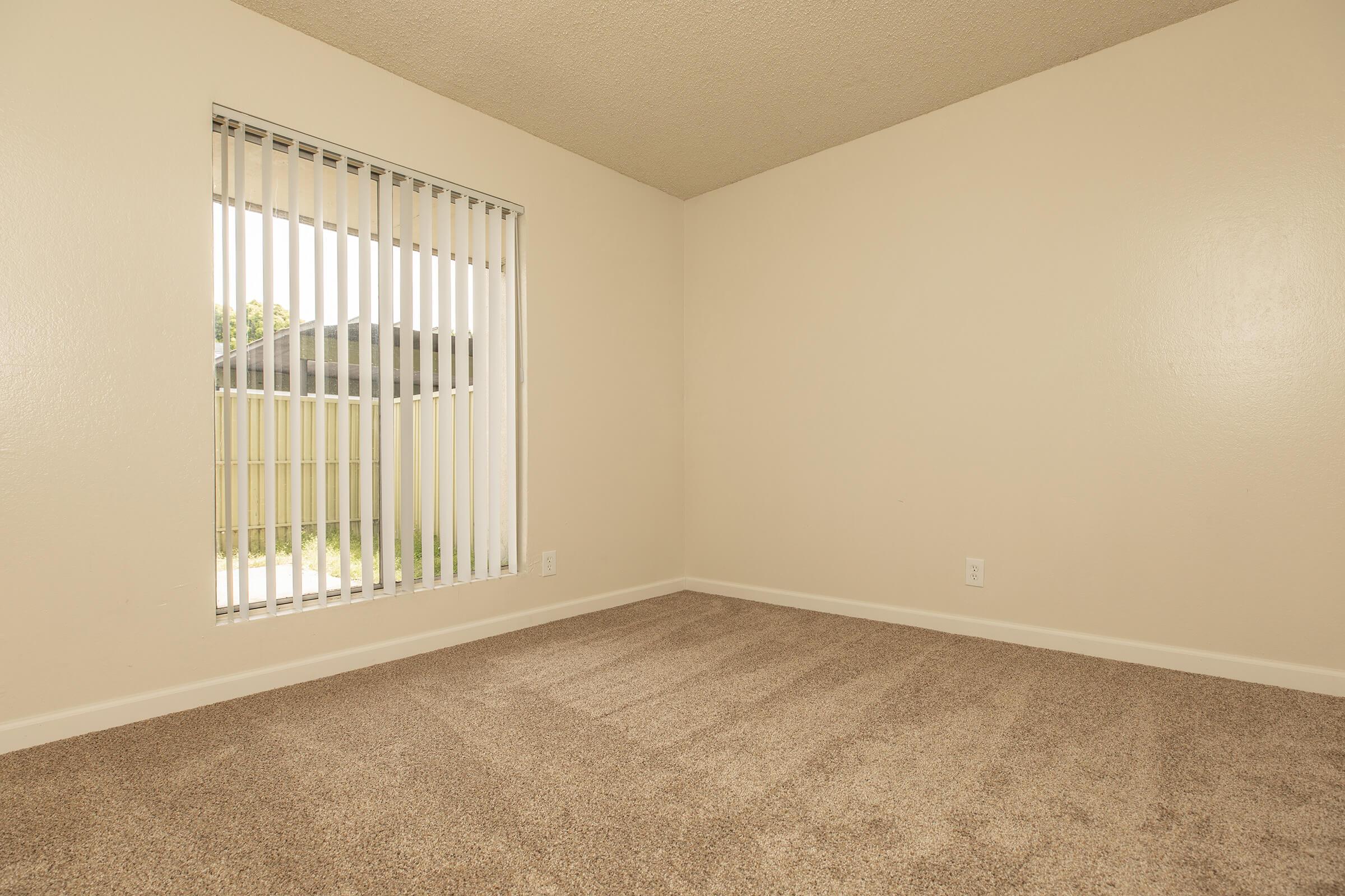 a bedroom with a large window