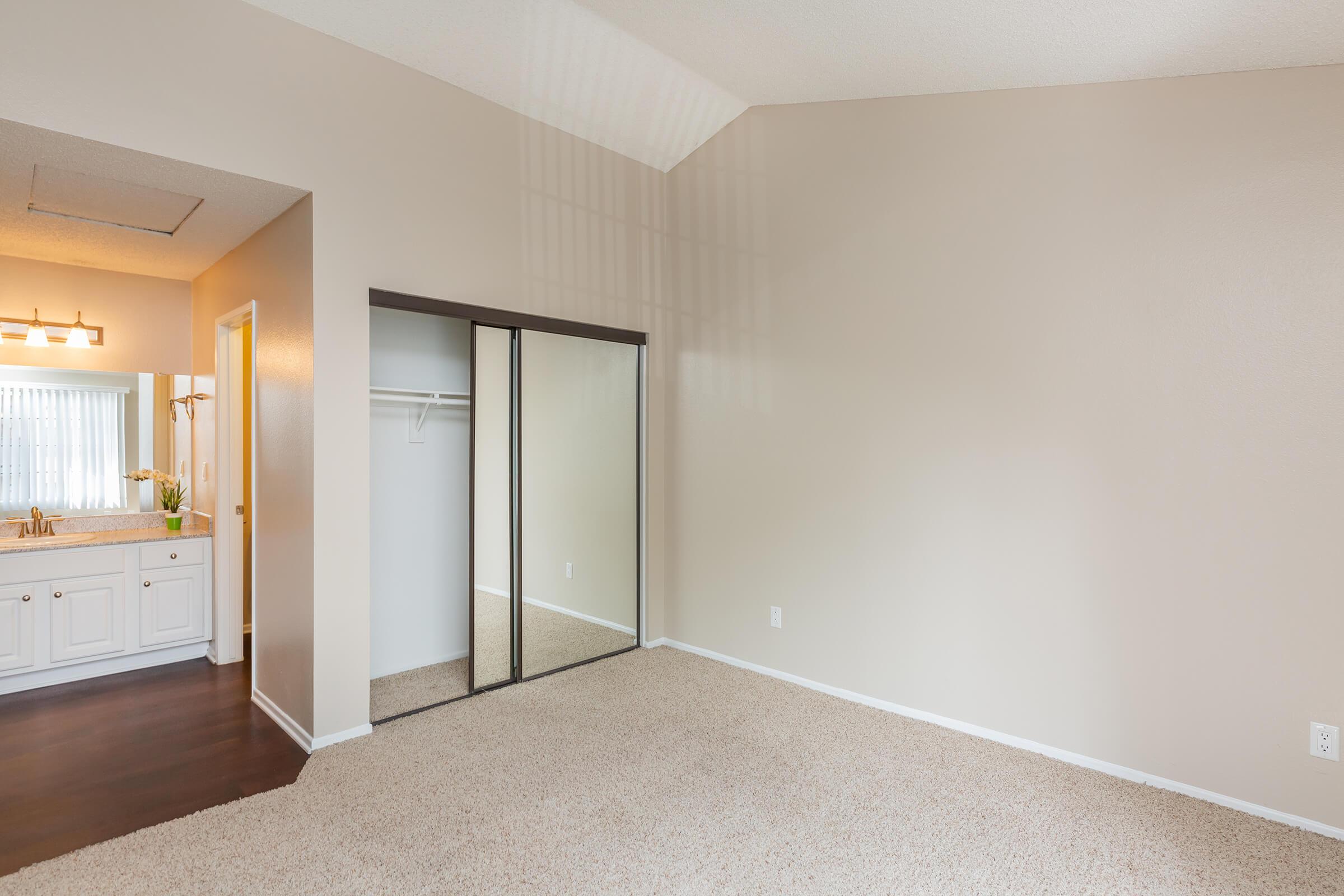 Bedroom with carpet and bathroom sink