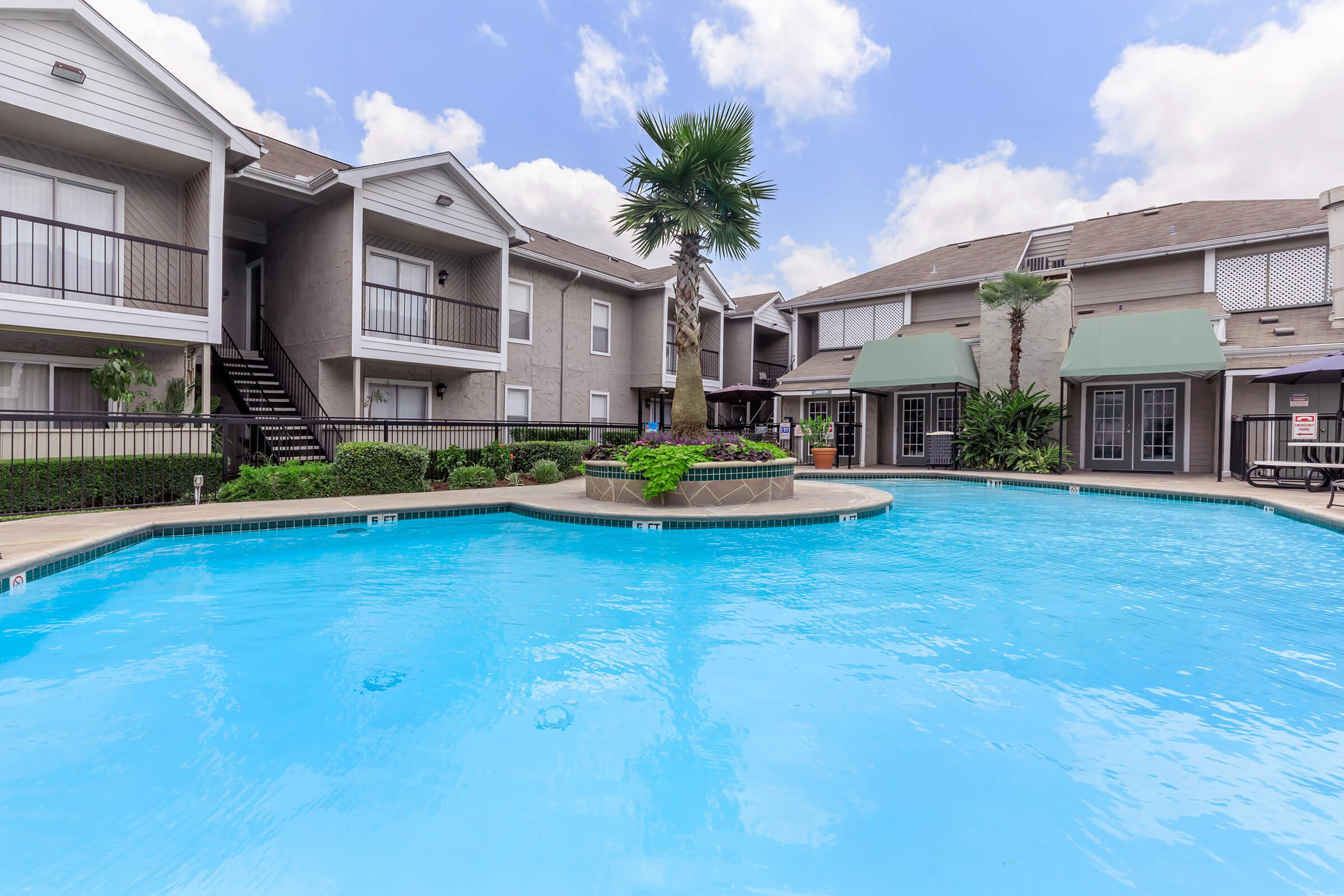 a house with a large pool of water