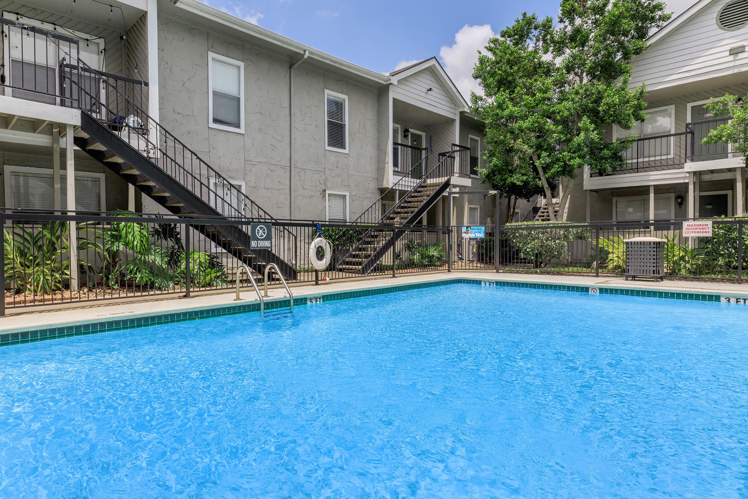 a house with a large pool of water