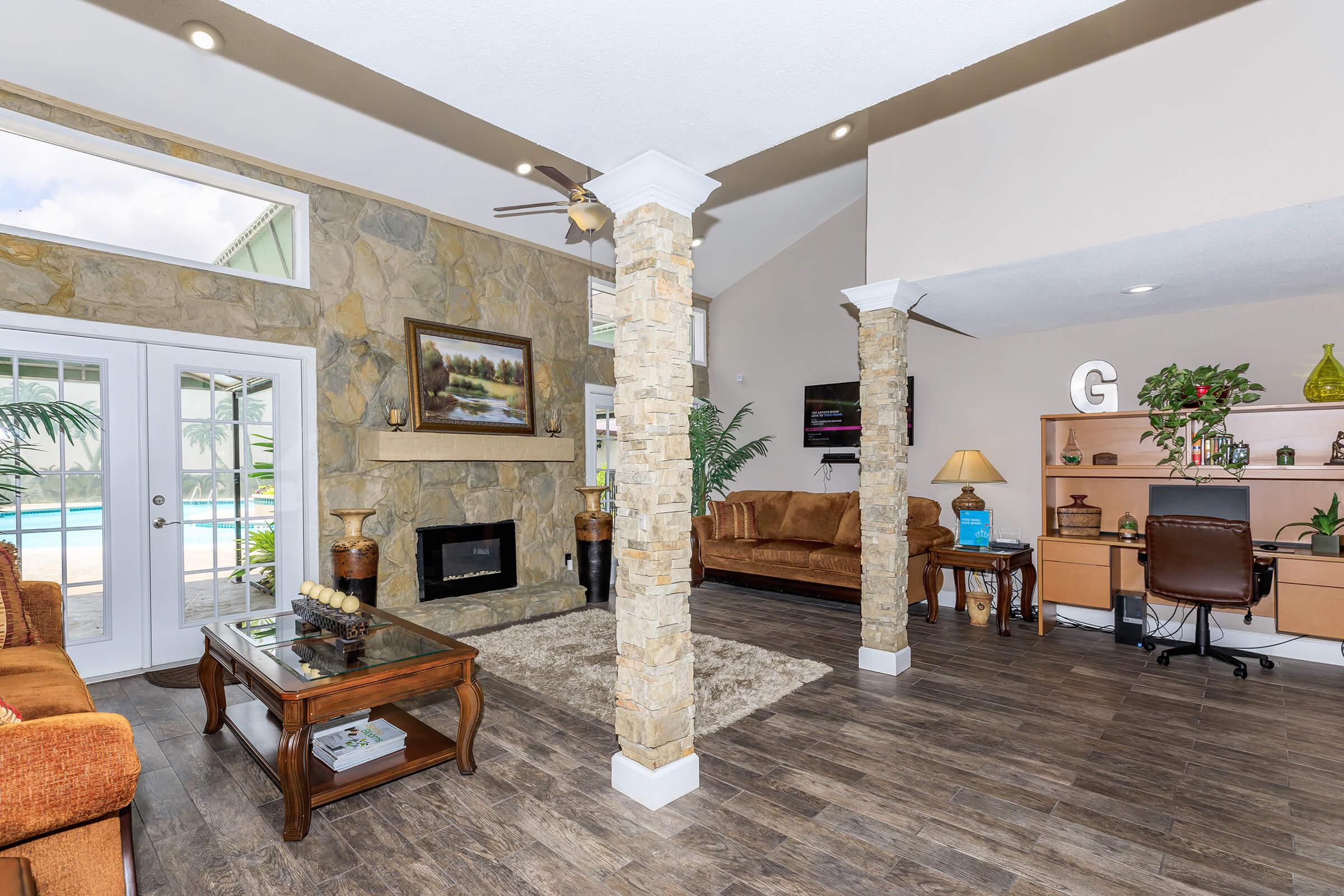 a living room filled with furniture and a fire place