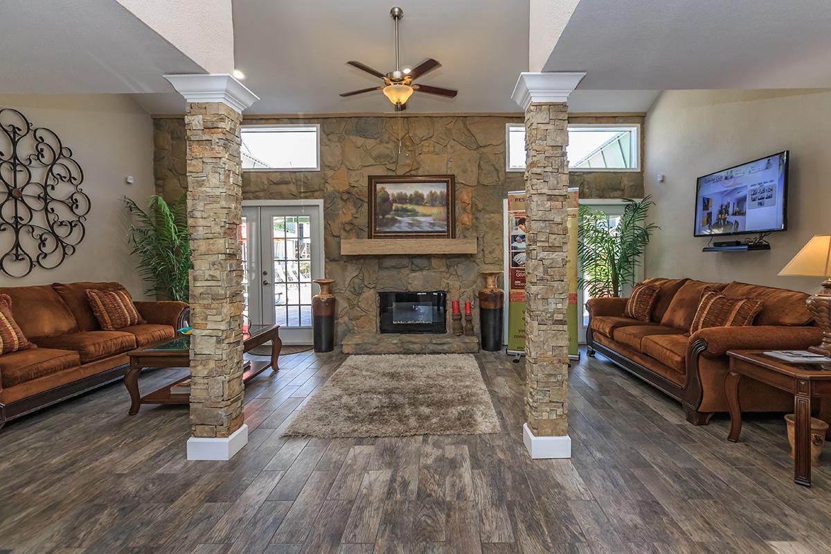 a living room filled with furniture and a fireplace