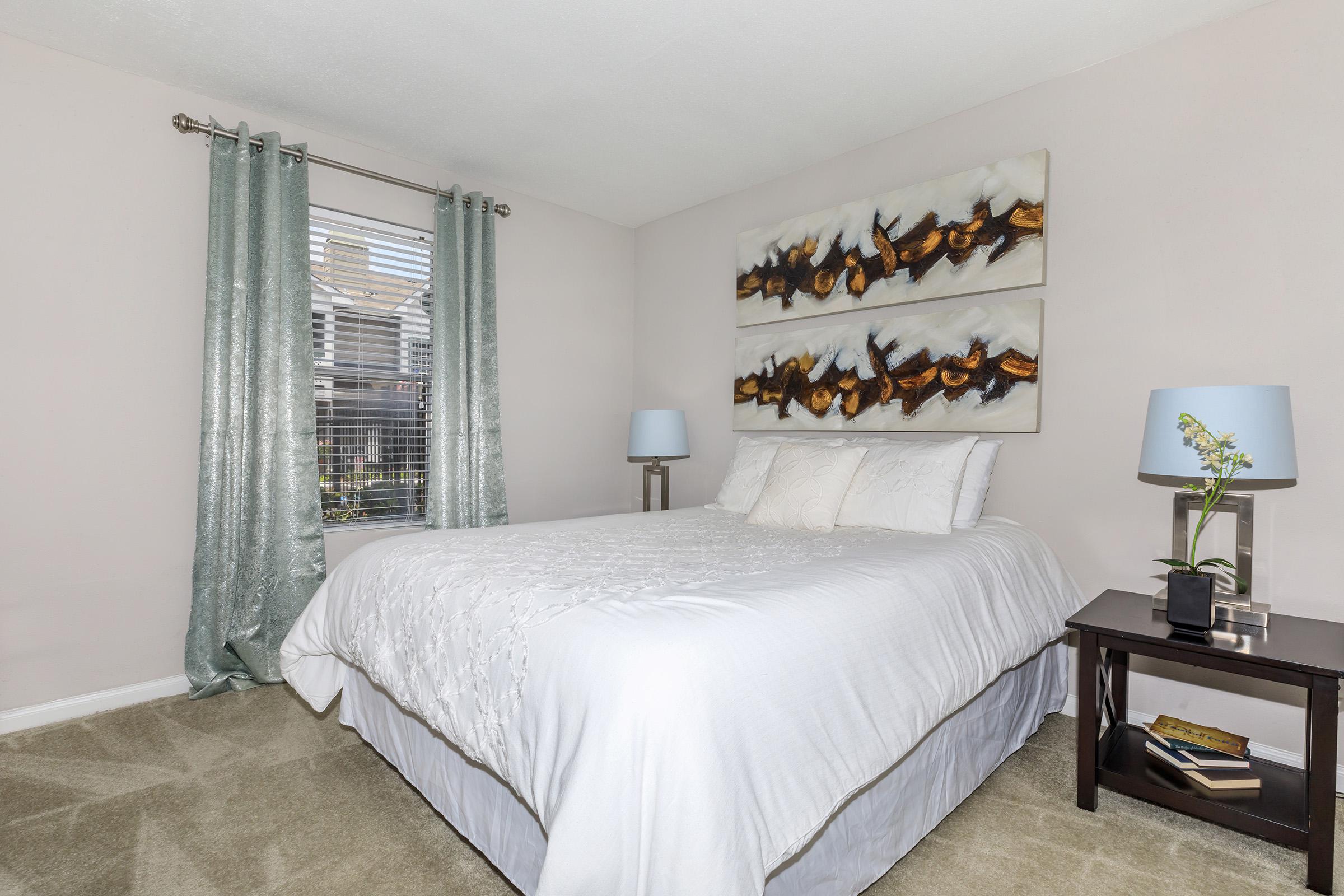 a bedroom with a large bed in a hotel room