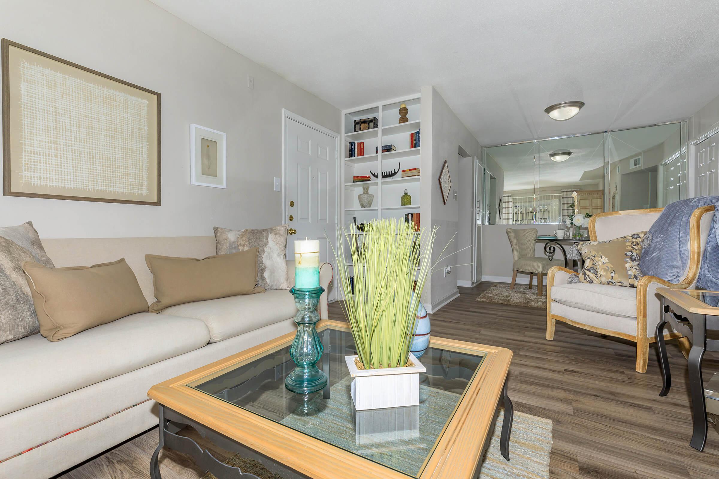 a living room filled with furniture and a table