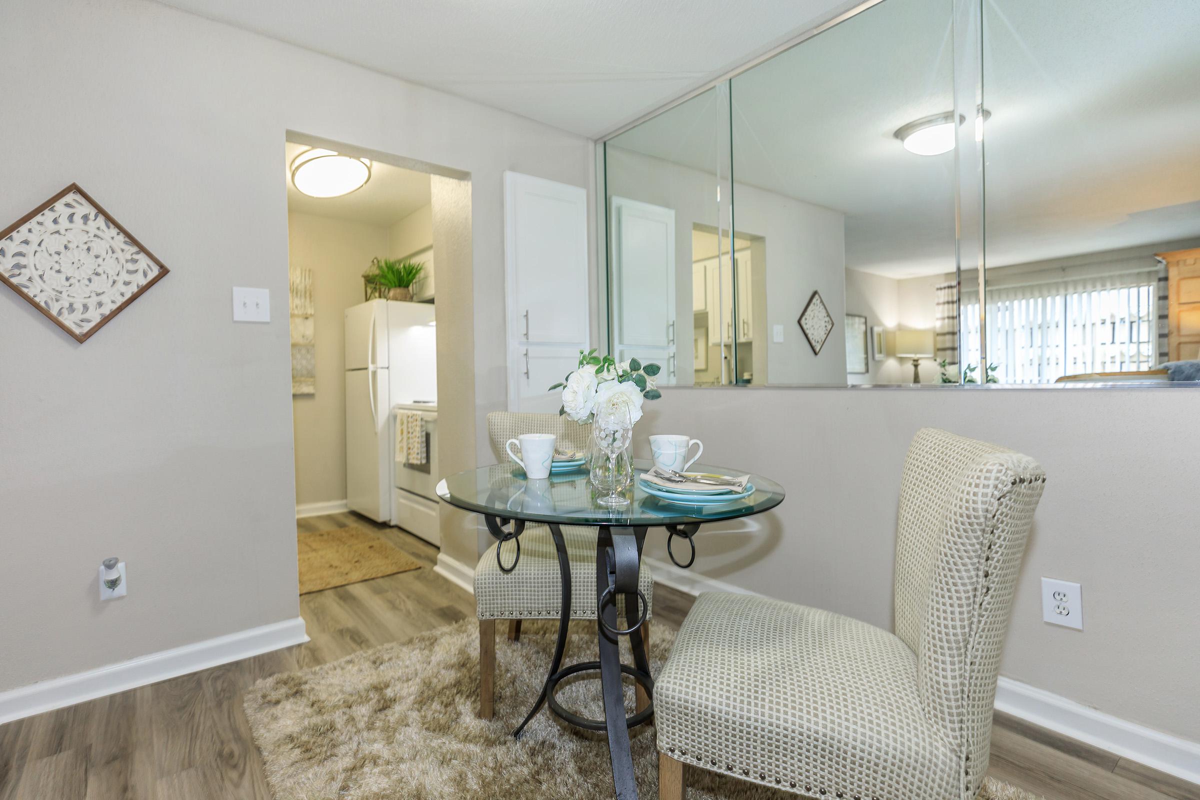 a room with a sink and a mirror