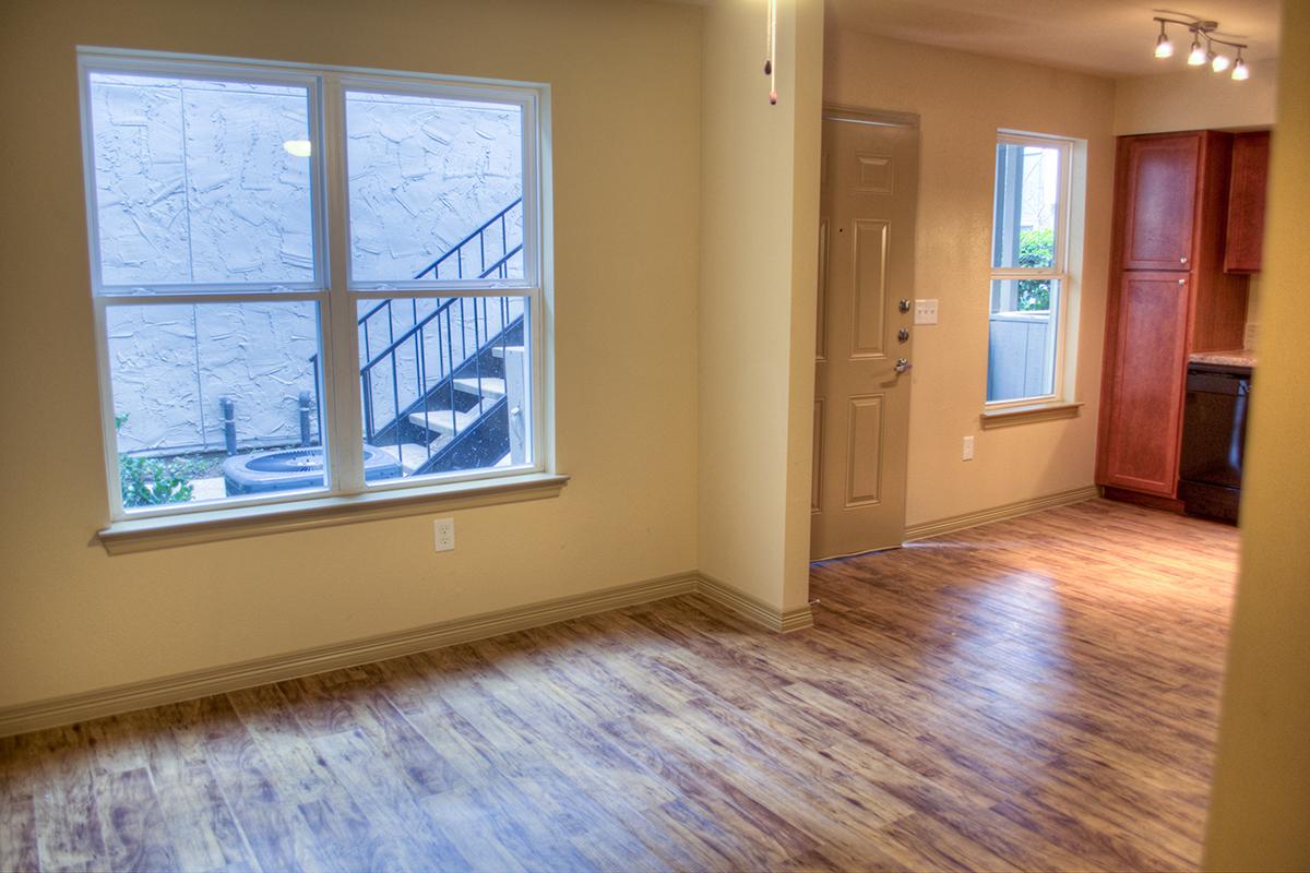 a large empty room with a wooden floor