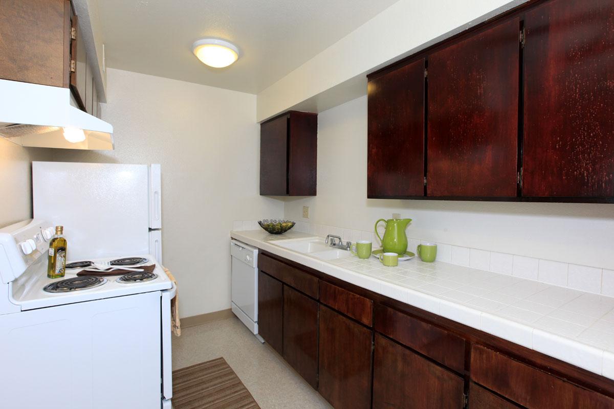 a kitchen with a sink and a refrigerator