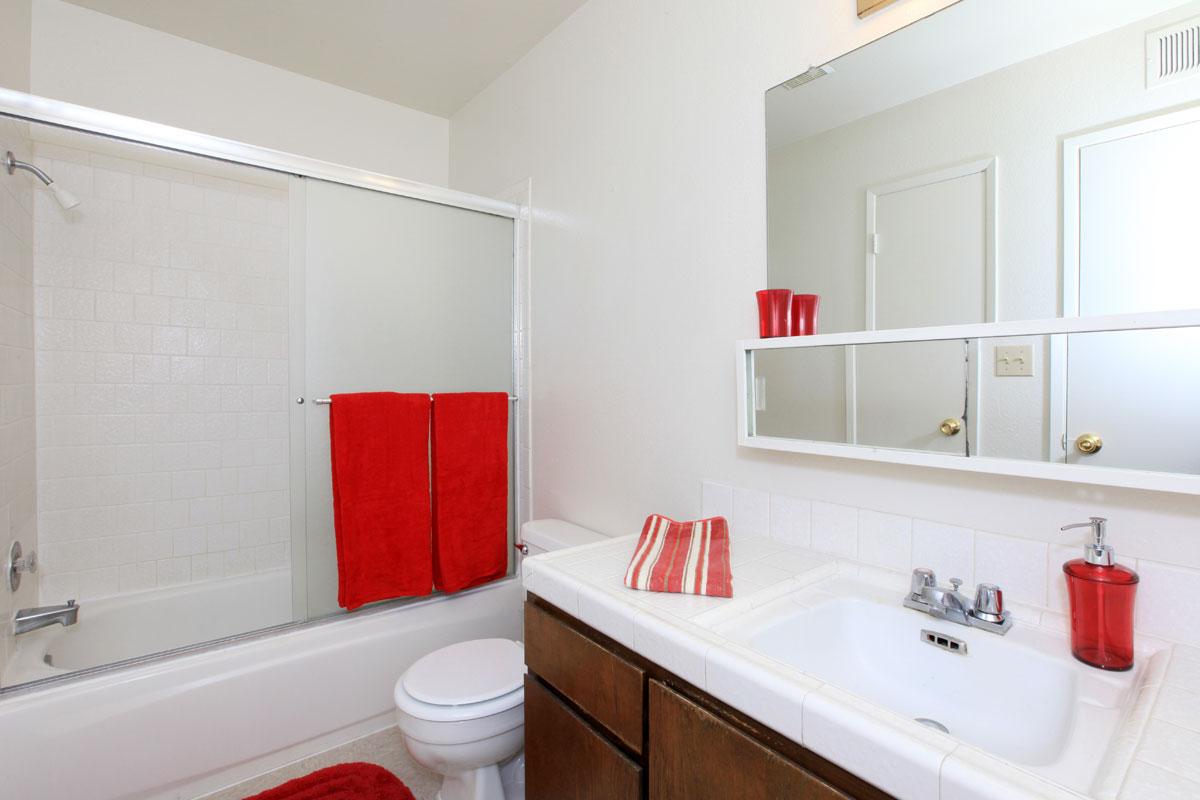 a room with a sink and a mirror