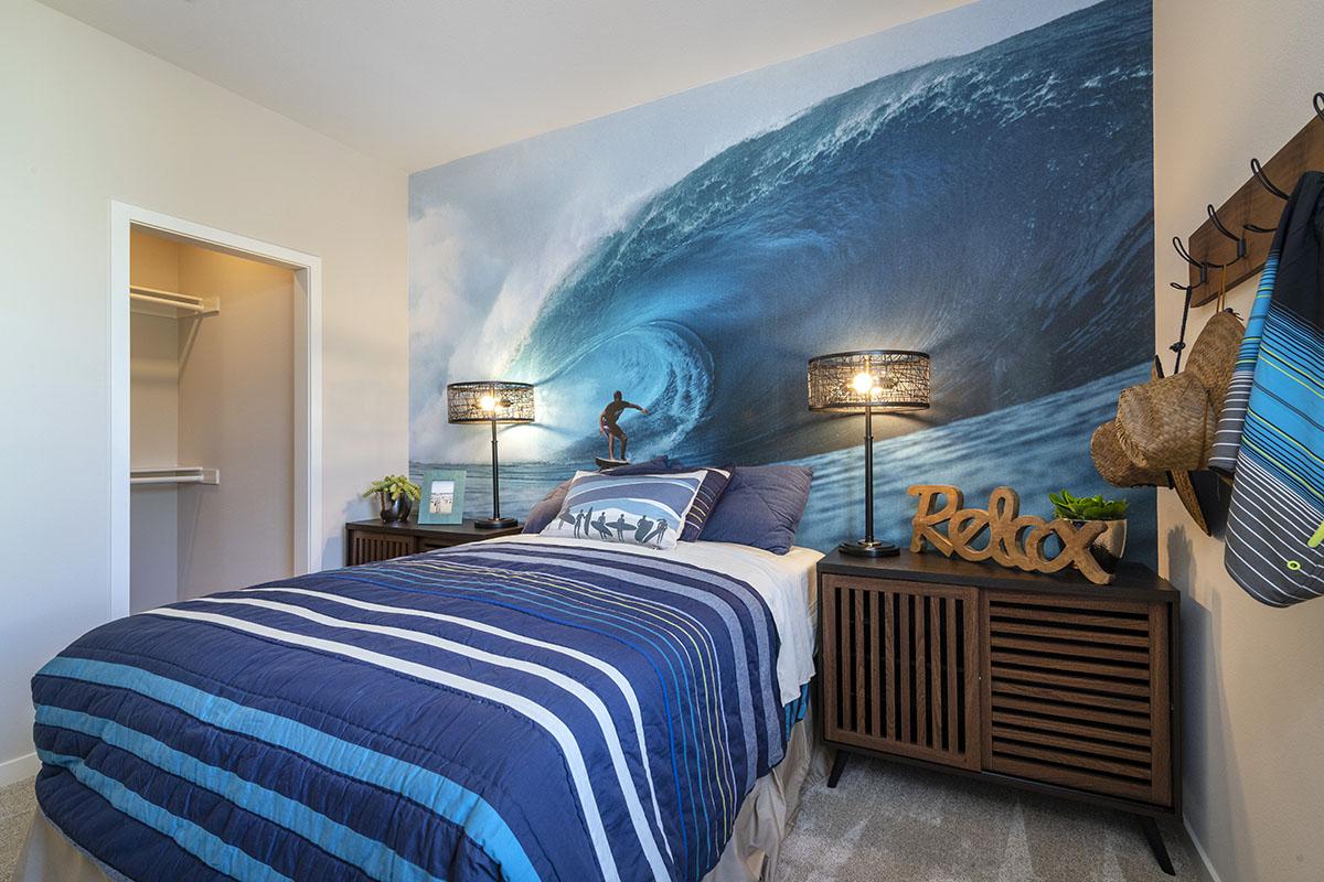 a bedroom with a bed in a room