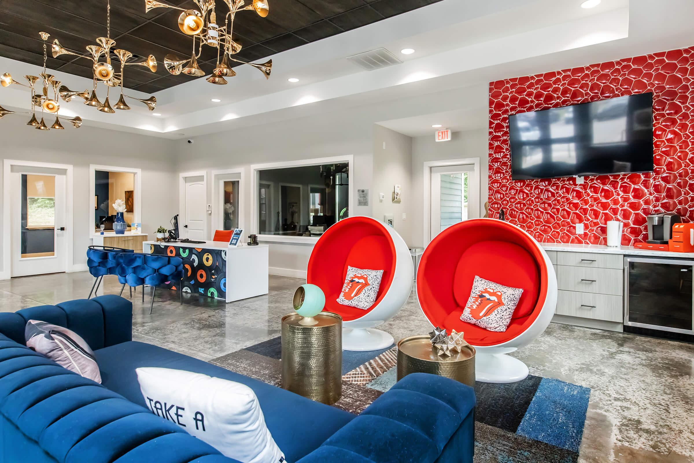 a living room filled with furniture and a flat screen tv