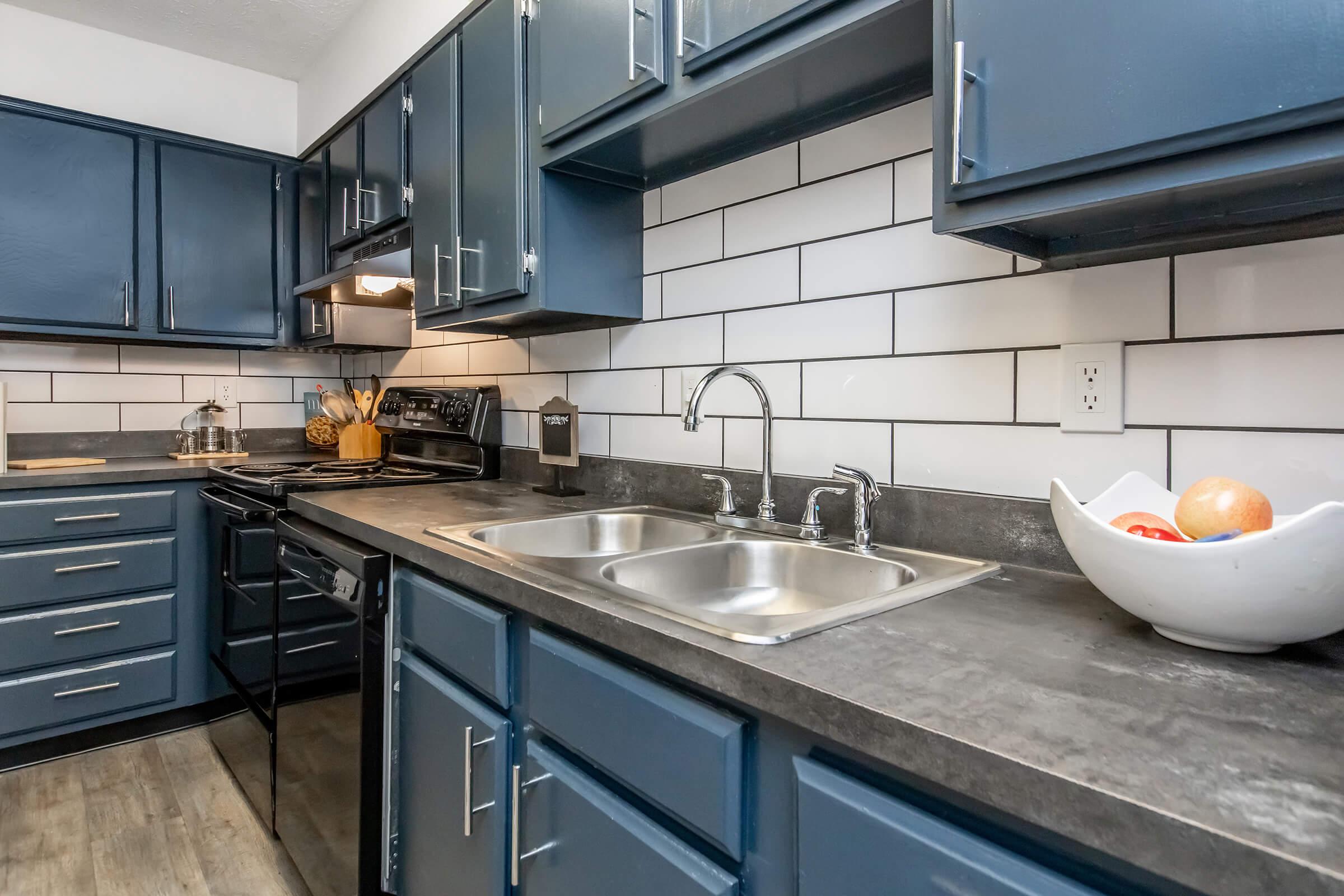 a modern kitchen with stainless steel appliances