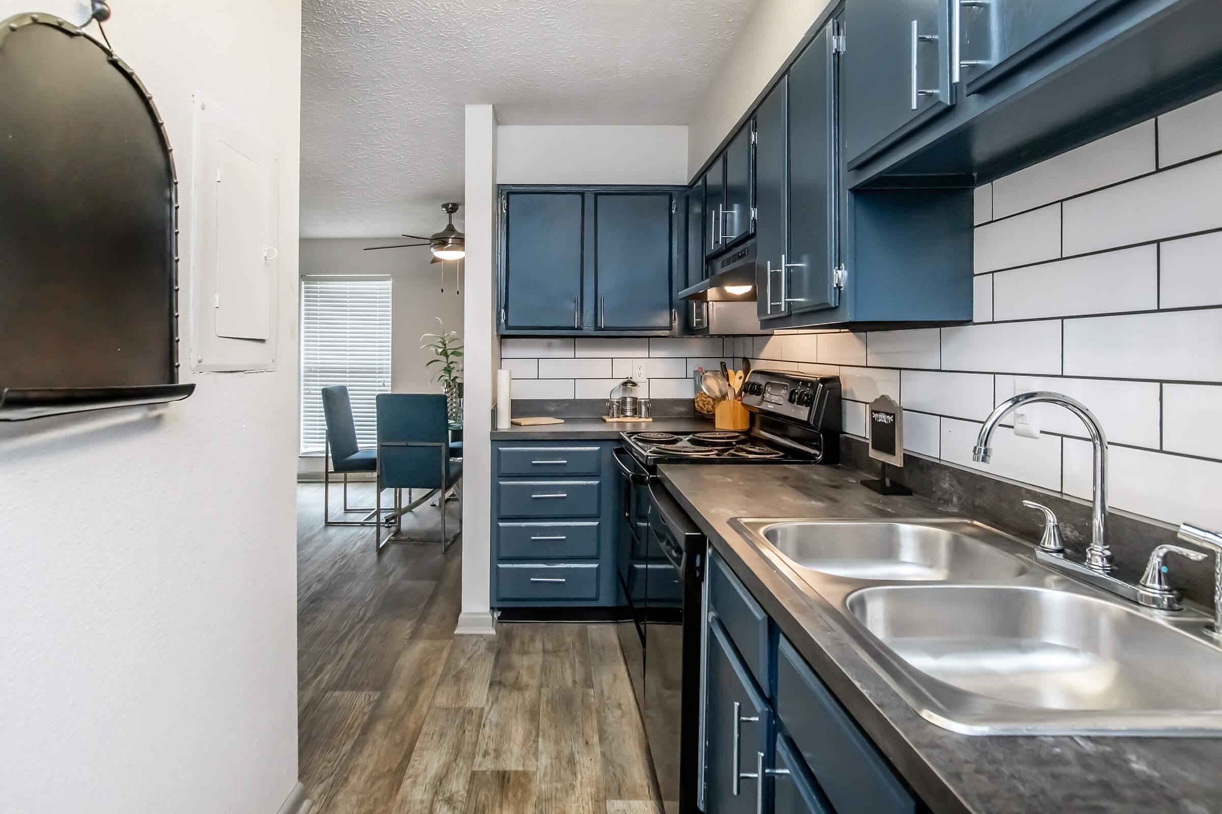 a modern kitchen with stainless steel appliances