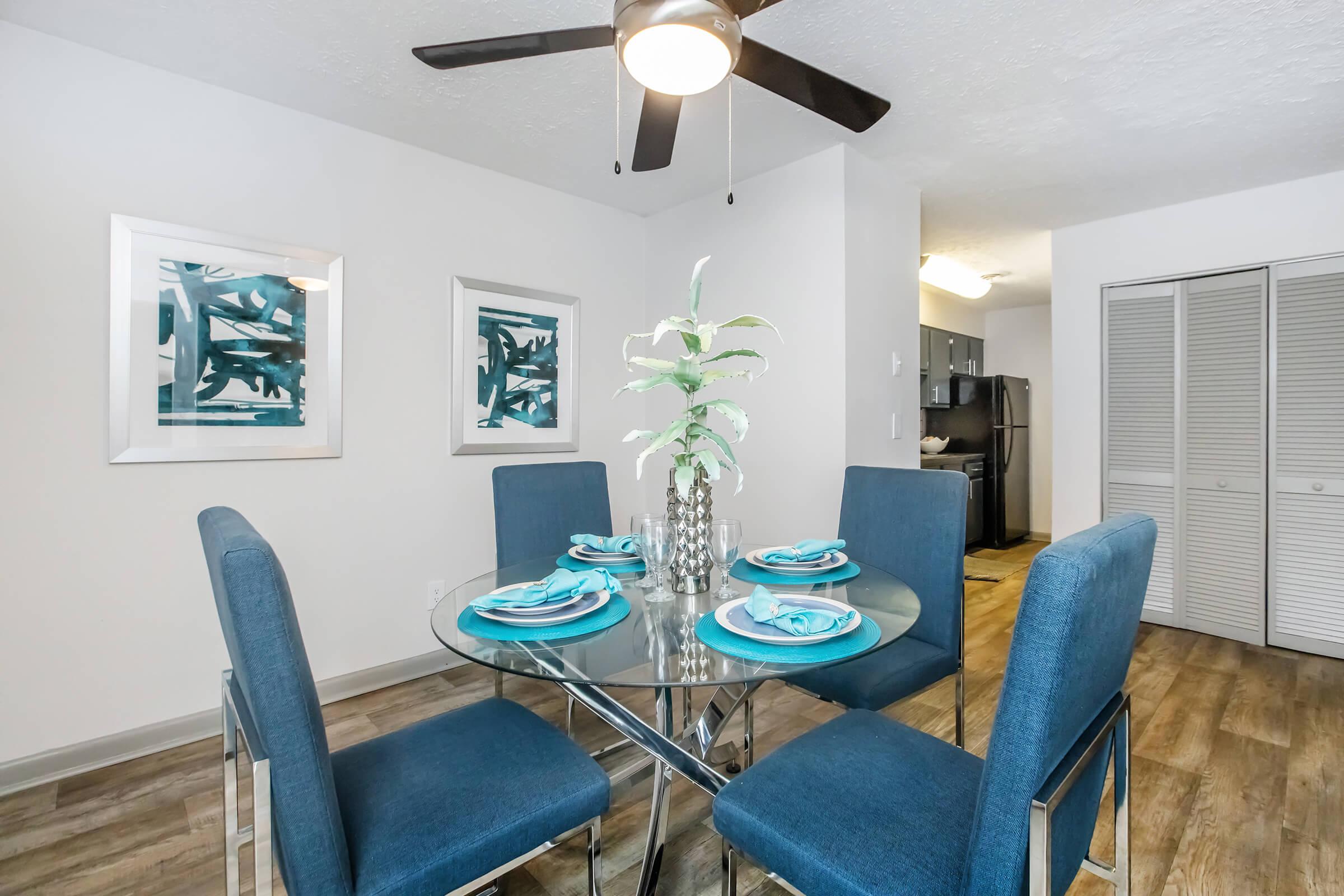 a living room with a blue chair