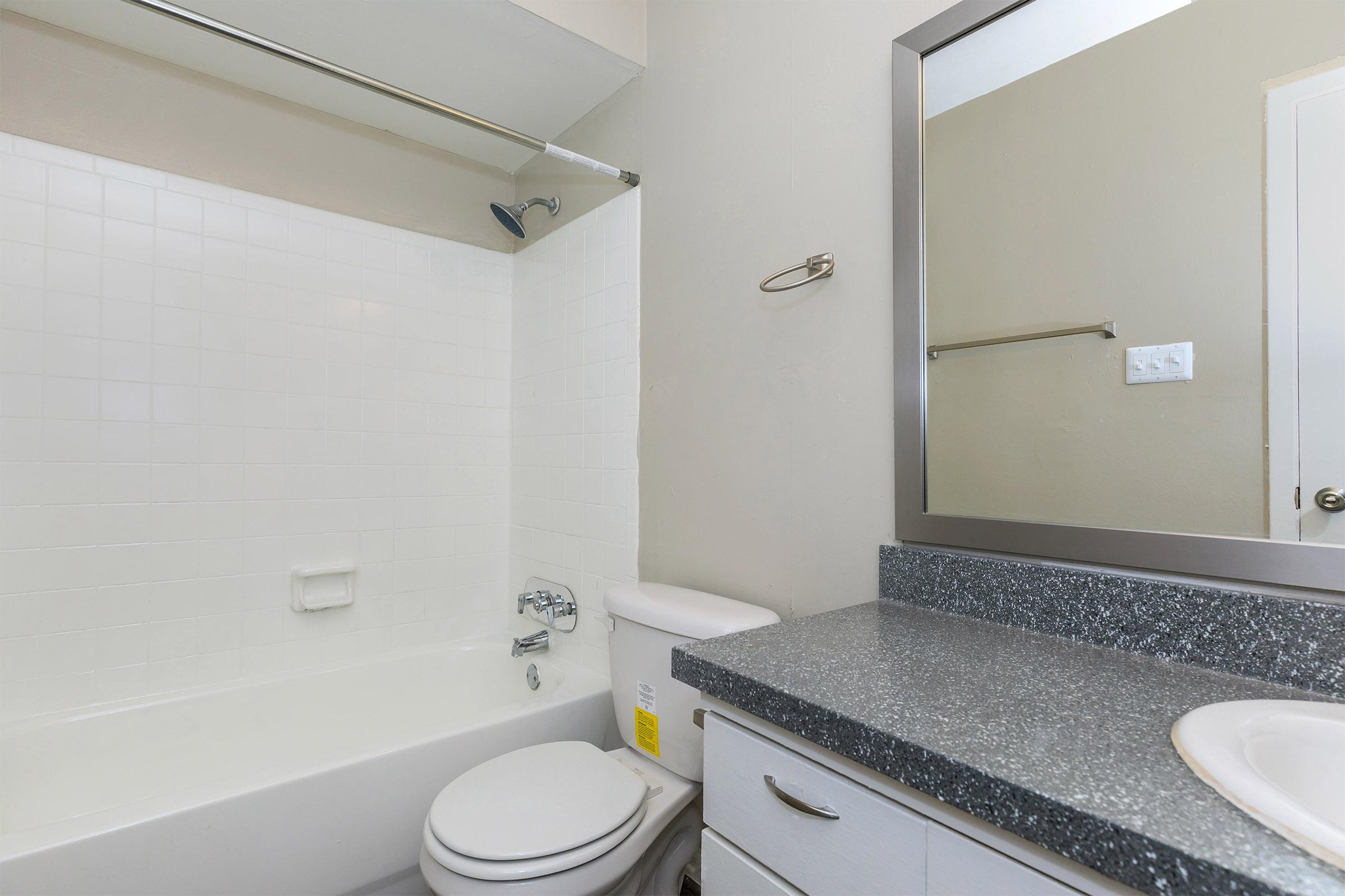 a white sink and a mirror
