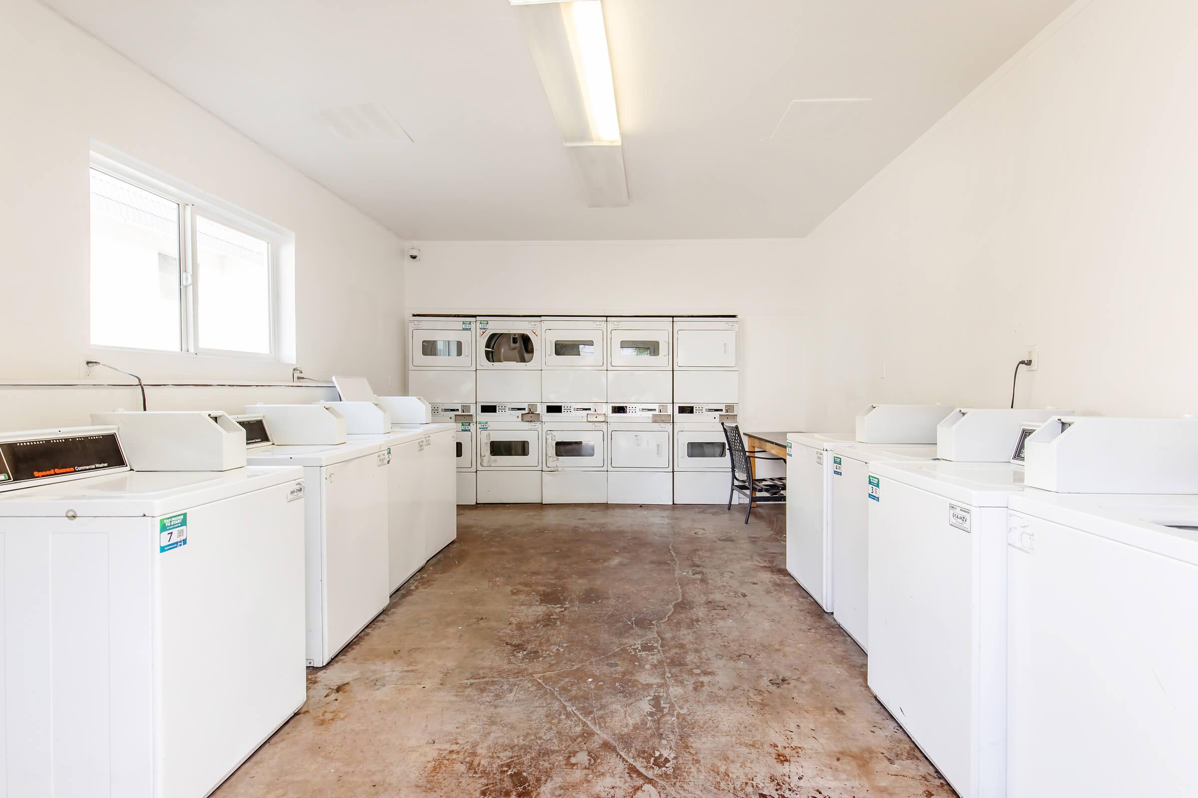 a kitchen with a sink and a refrigerator